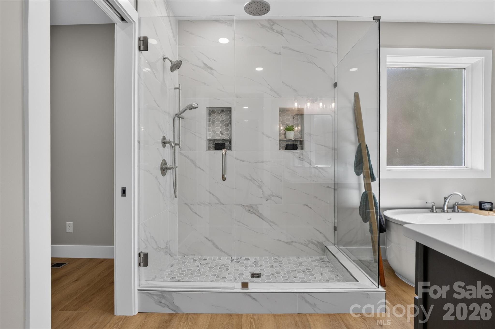 Beautiful walk-in shower in this primary bathroom. - 160 Pumice Drive, Statesville