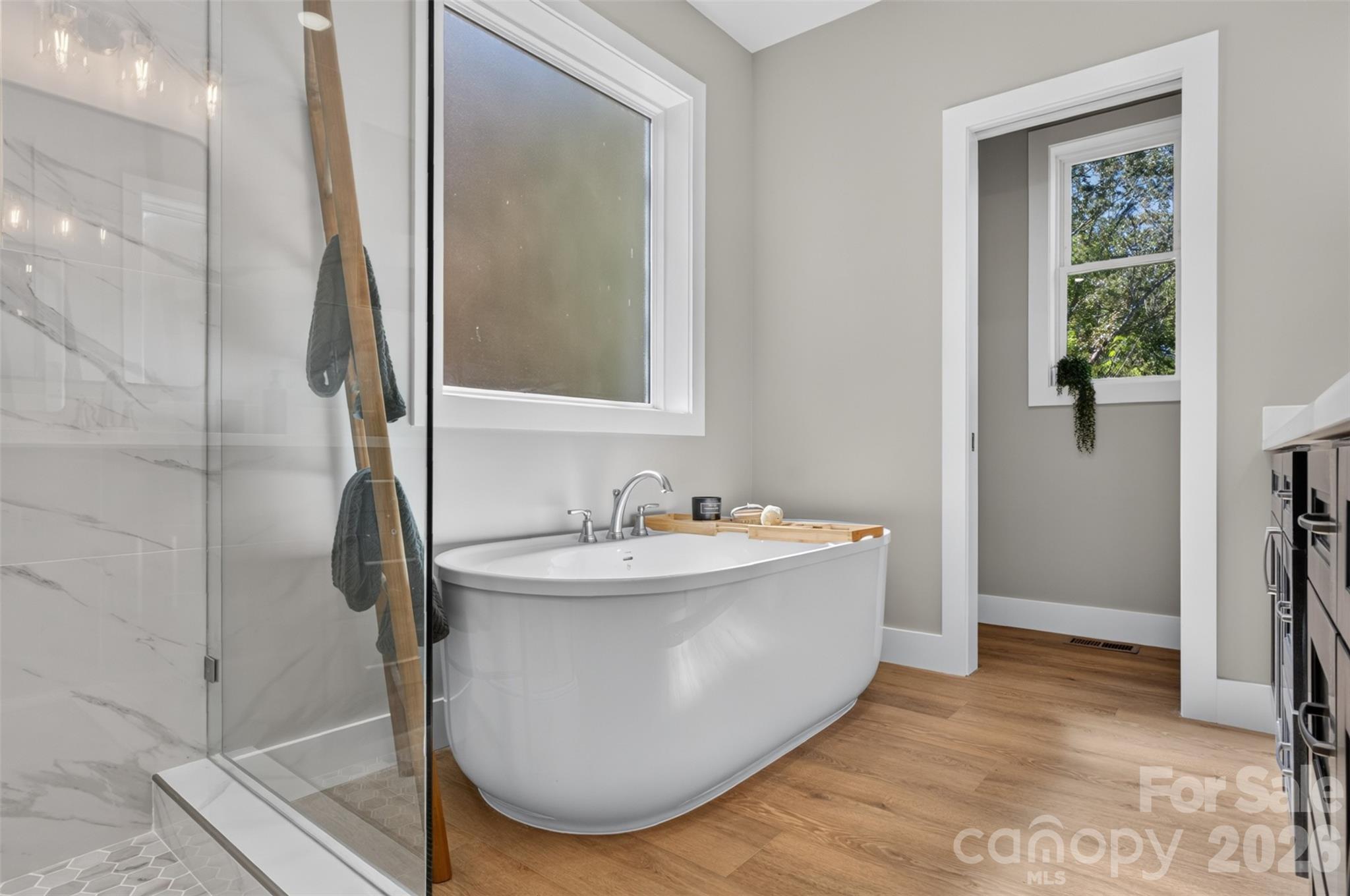 This spa like primary bathroom is complete with a soaking tub. - 160 Pumice Drive, Statesville