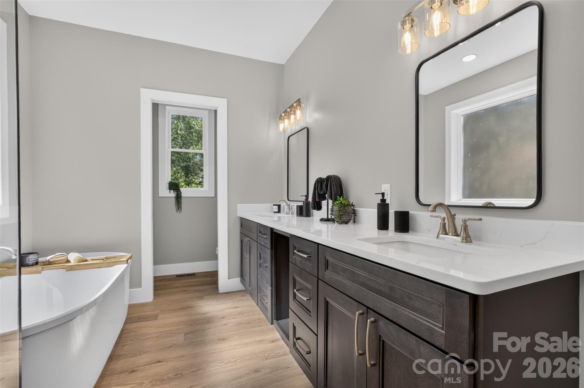 We just love the large vanity in this primary bathroom. - 160 Pumice Drive, Statesville