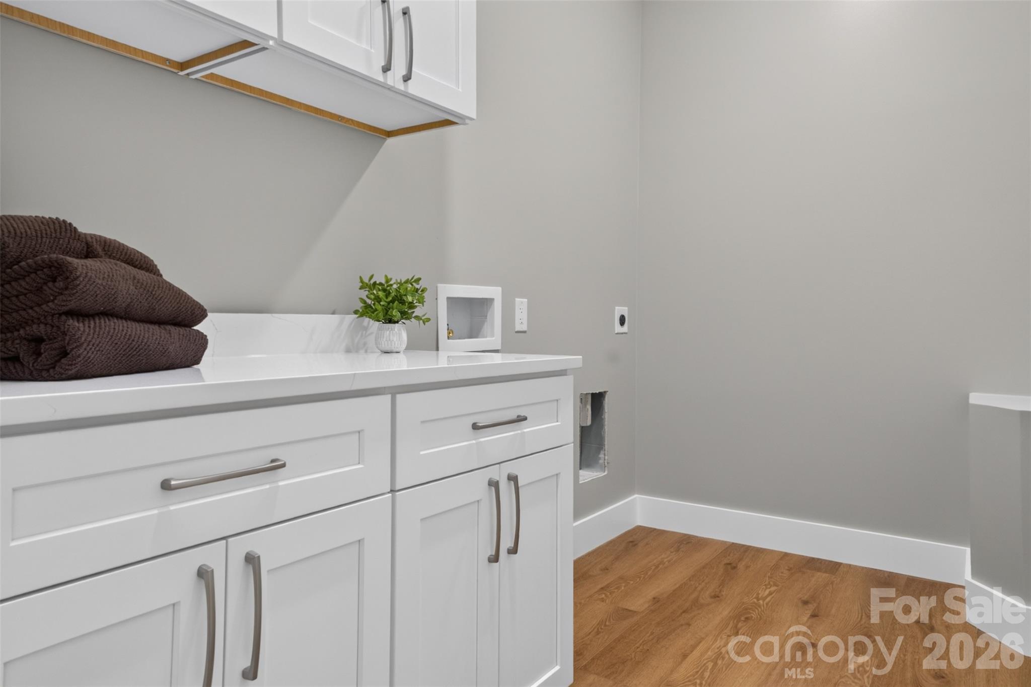 Laundry room is located just off the garage, the primary bedroom and steps away from the kitchen. - 160 Pumice Drive, Statesville
