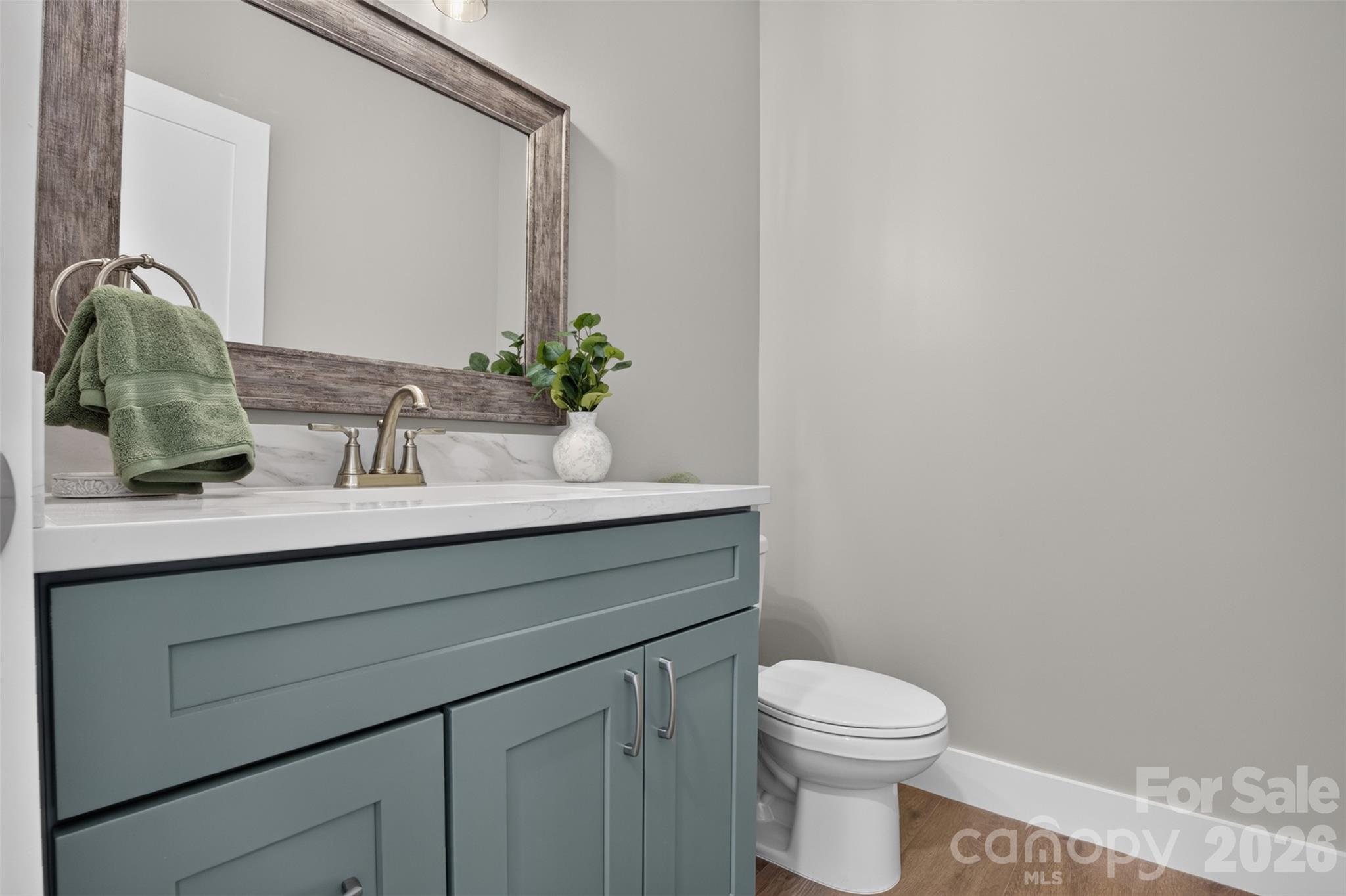 There is a half bathroom on the main floor just off the front foyer. - 160 Pumice Drive, Statesville