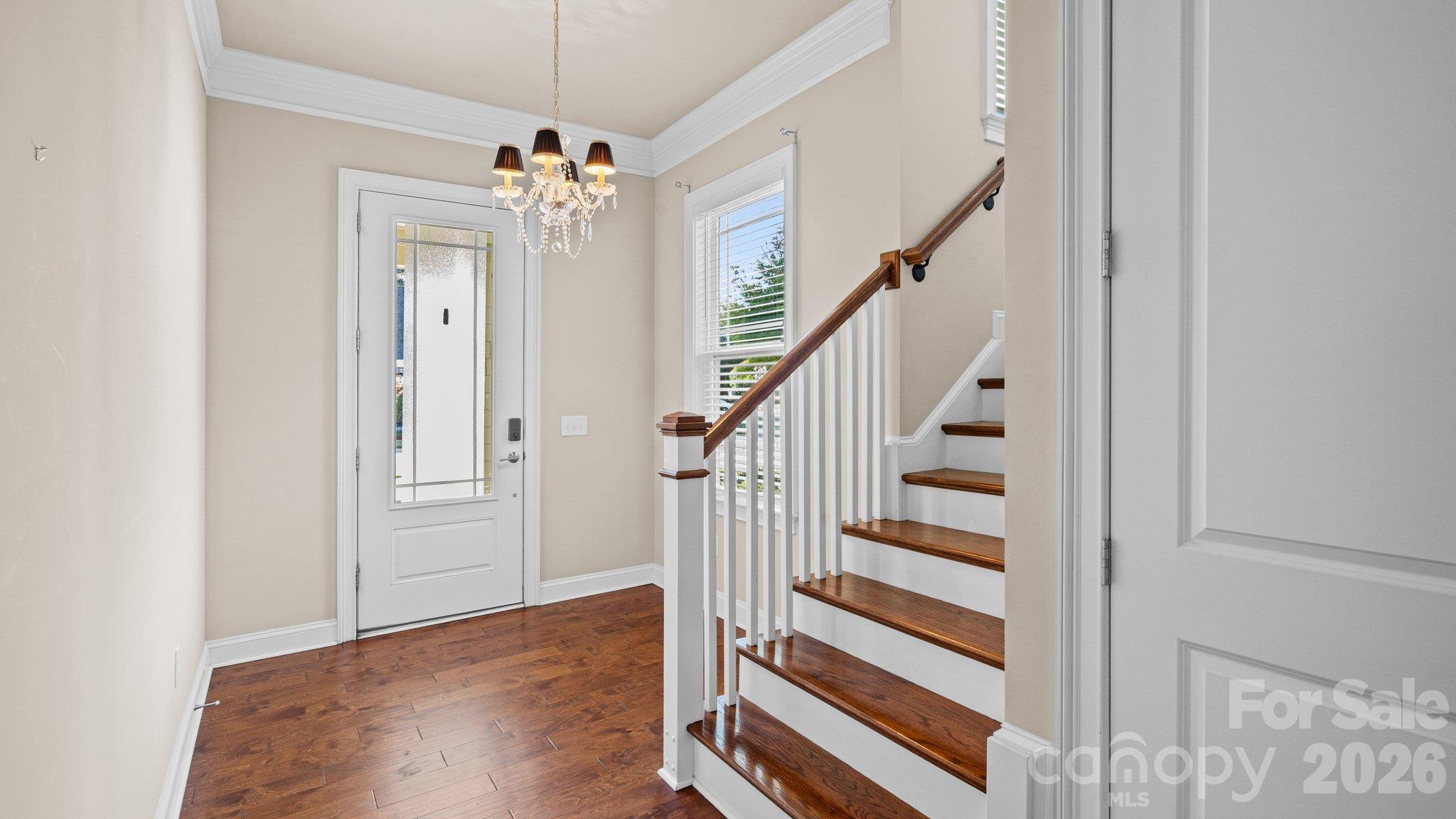 Bright entry foyer with chandelier and staircase - 2050 Laney Pond Road, Matthews