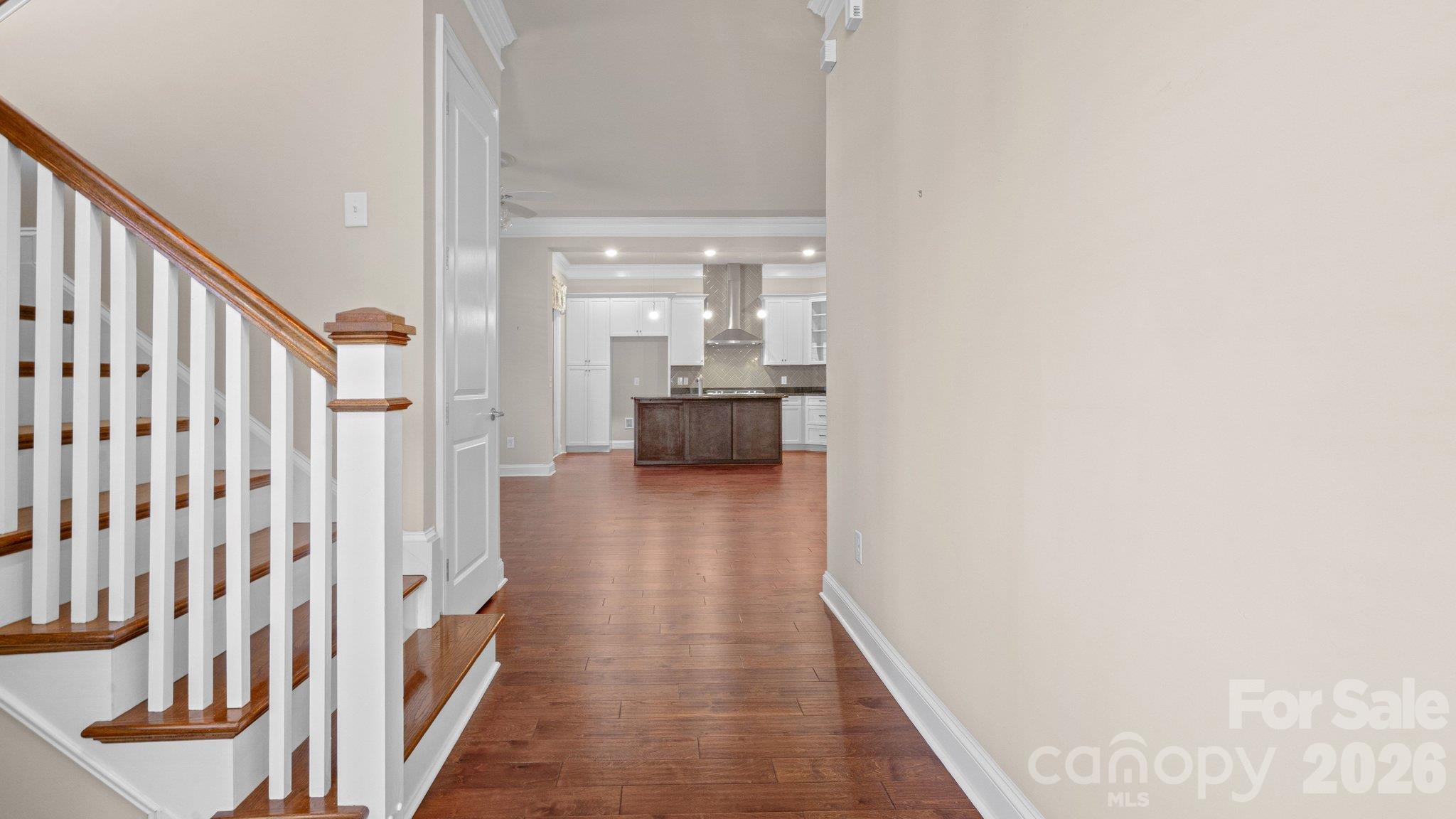 Hallway with view through to the kitchen - 2050 Laney Pond Road, Matthews
