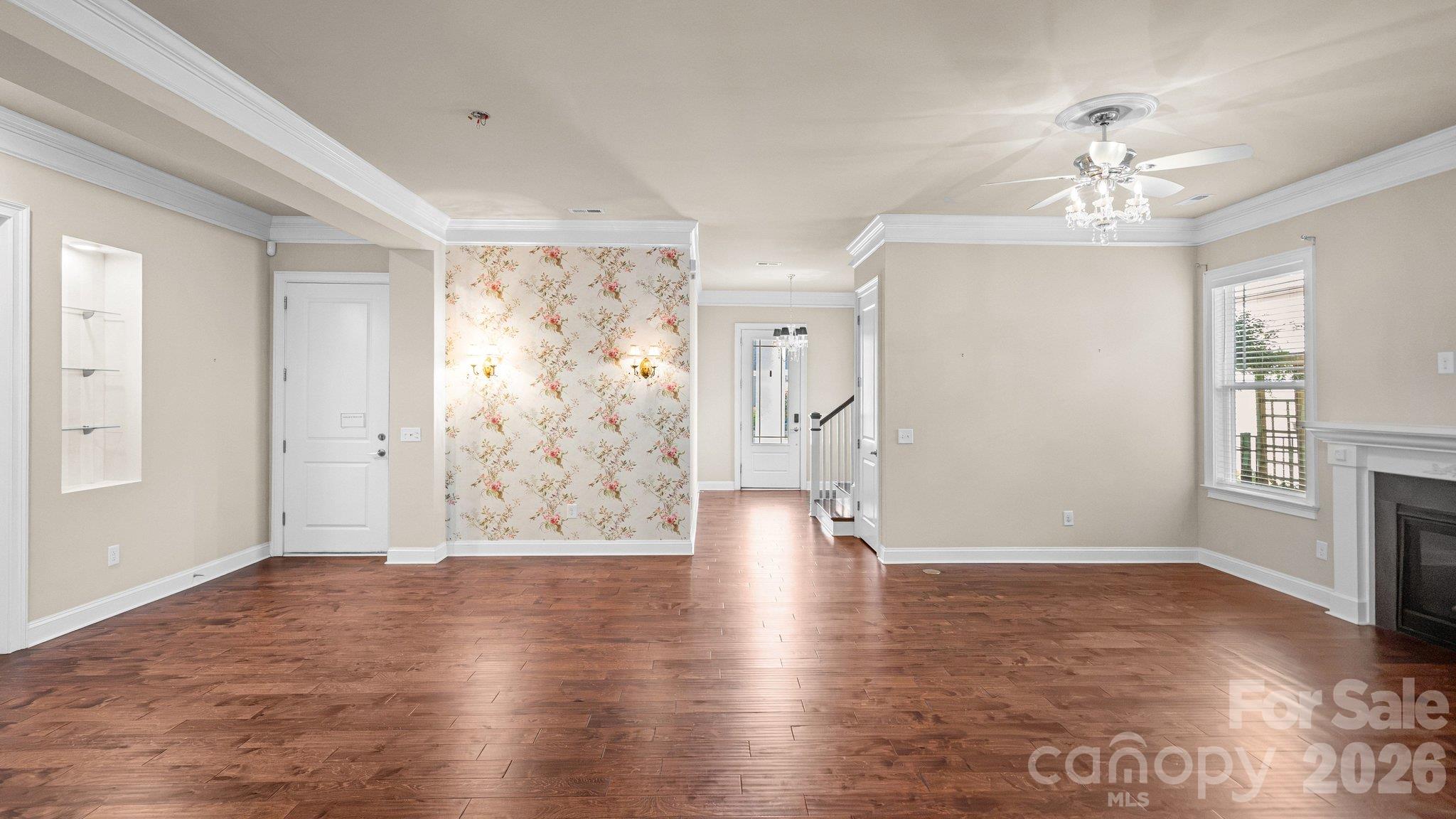 Living area with fireplace and designer accent wall - 2050 Laney Pond Road, Matthews