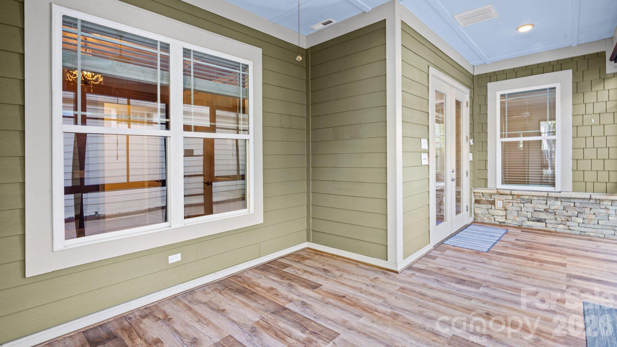 Sunroom with windows on three sides - 2050 Laney Pond Road, Matthews