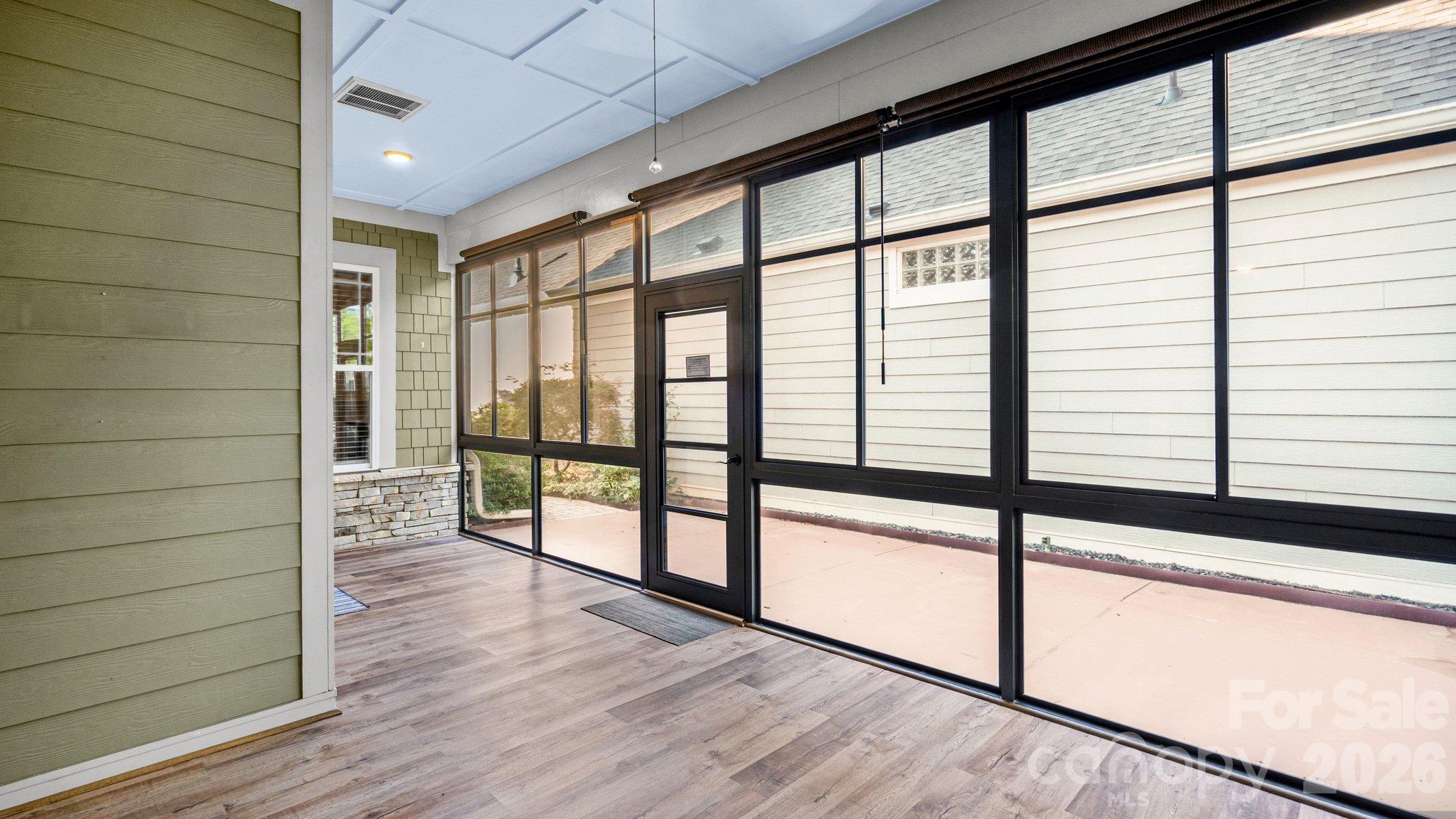Sunroom with luxury plank flooring - a great spot to relax - 2050 Laney Pond Road, Matthews