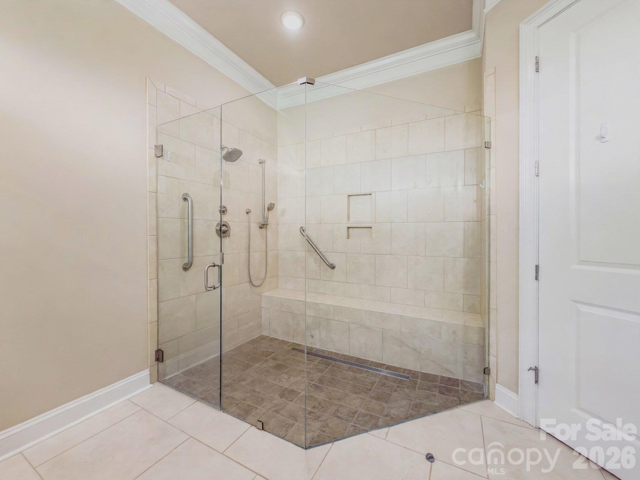 Walk-in tiled shower with frameless glass enclosure - 2050 Laney Pond Road, Matthews