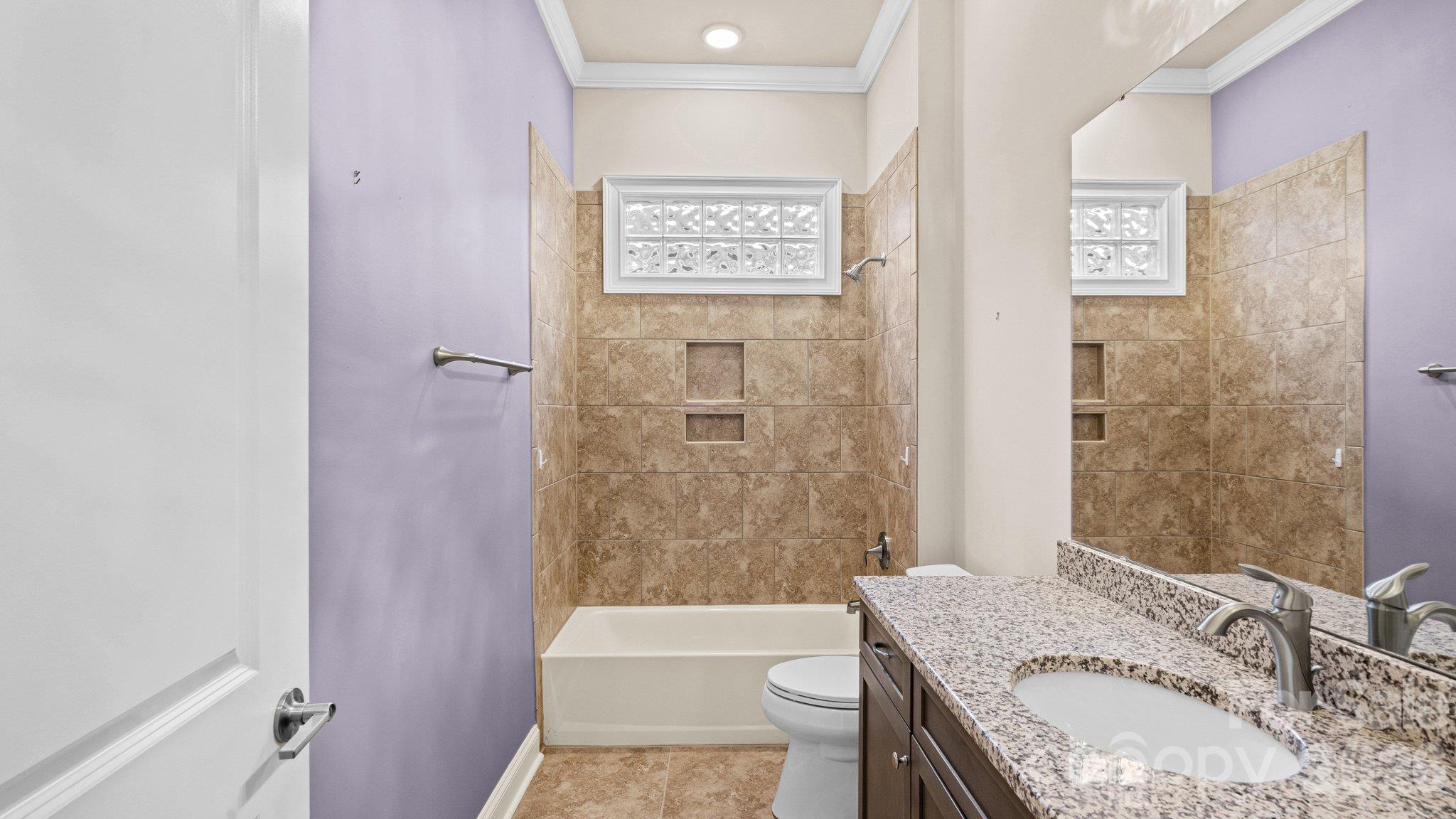 Full bath with tub/shower combo and tile surround - 2050 Laney Pond Road, Matthews