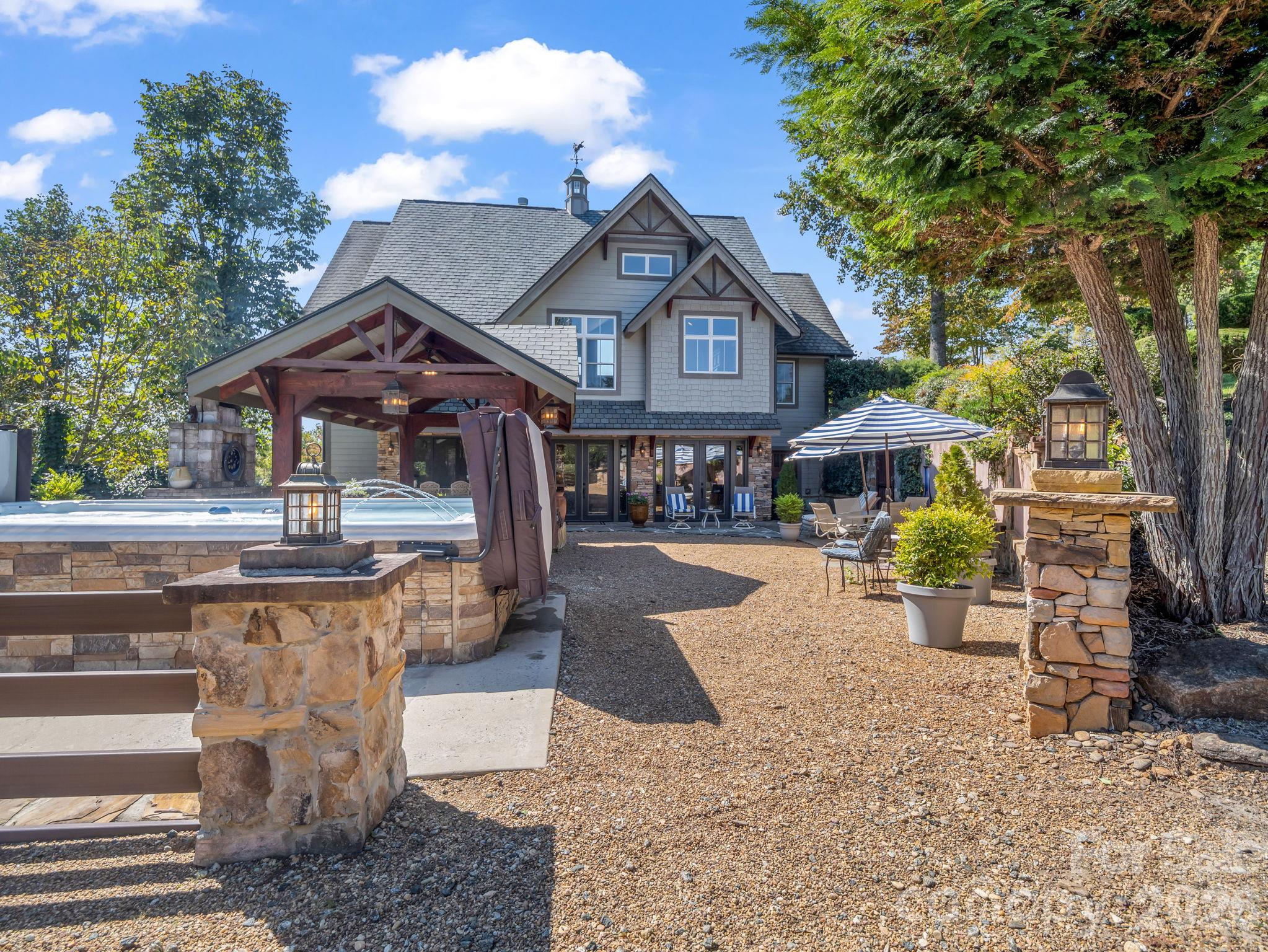 With the outdoor pavilion and fireplace, swim spa and Italian feel, you'll feel like you're always on vacation - 140 Blazing Star Lane, Mill Spring