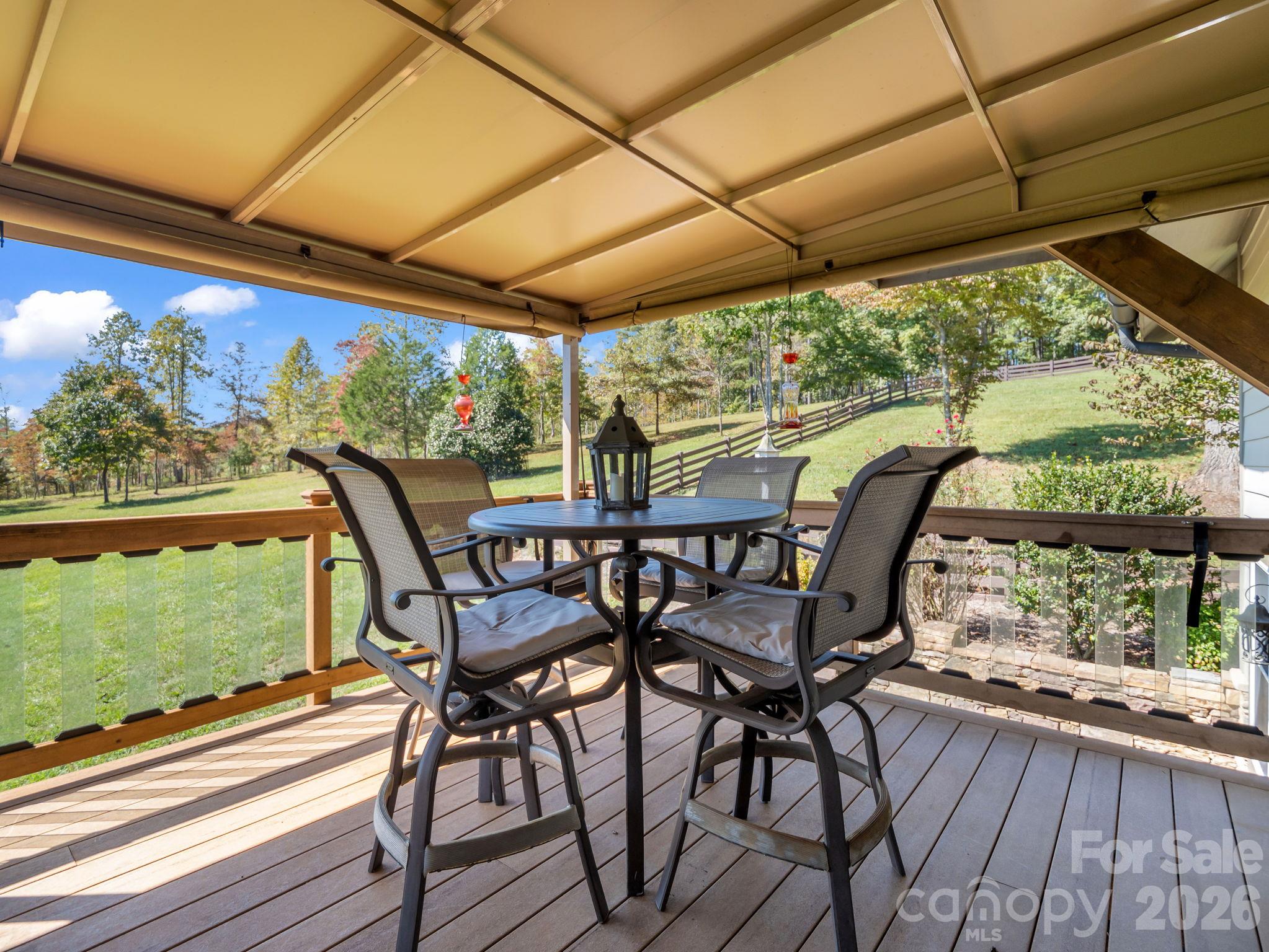 Peaceful getaway on the covered back deck while overlooking the beautiful mountain views - 140 Blazing Star Lane, Mill Spring