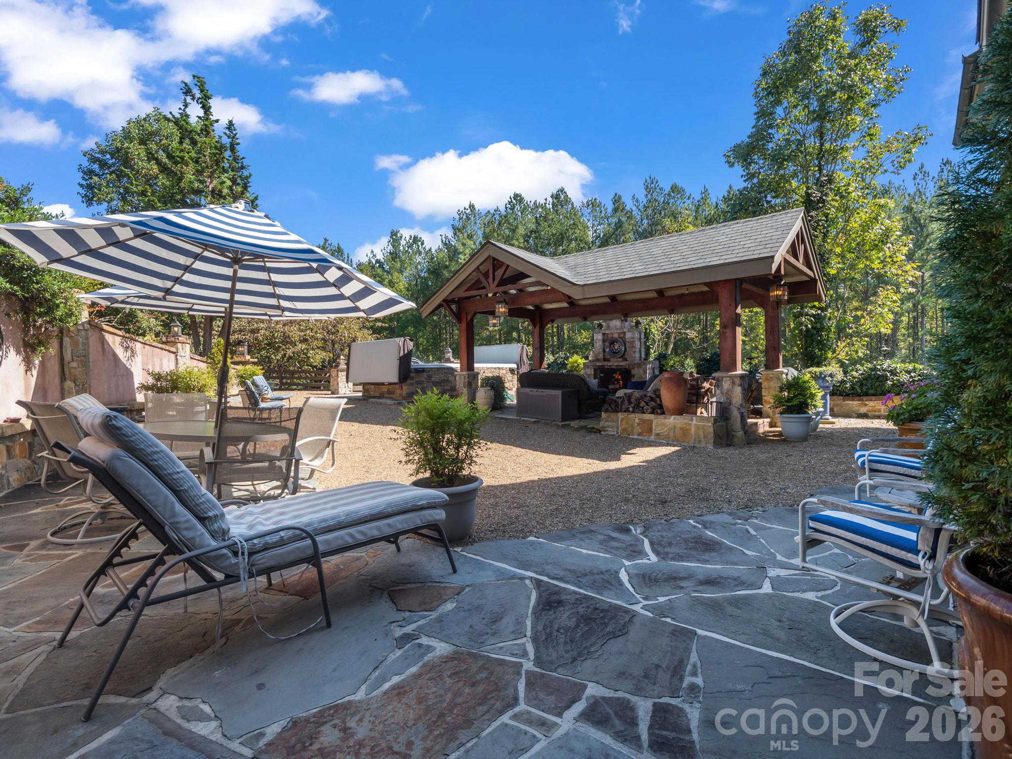Outdoor pavilion with wood burning fireplace, swim spa and luxurious Italian inspired ambiance - 140 Blazing Star Lane, Mill Spring