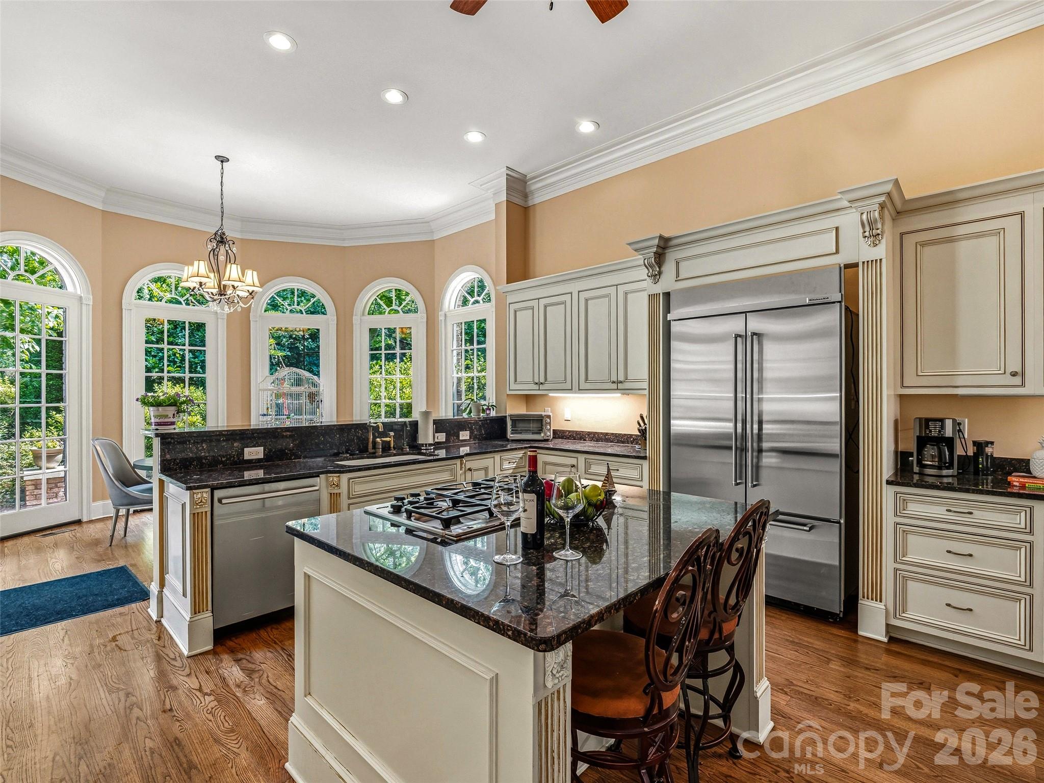 Kitchen Dual wall ovens. Gascooktop. Oversized island.Designed for the gathering, notjust the meal. - 150 Rainbow View Drive, Fletcher