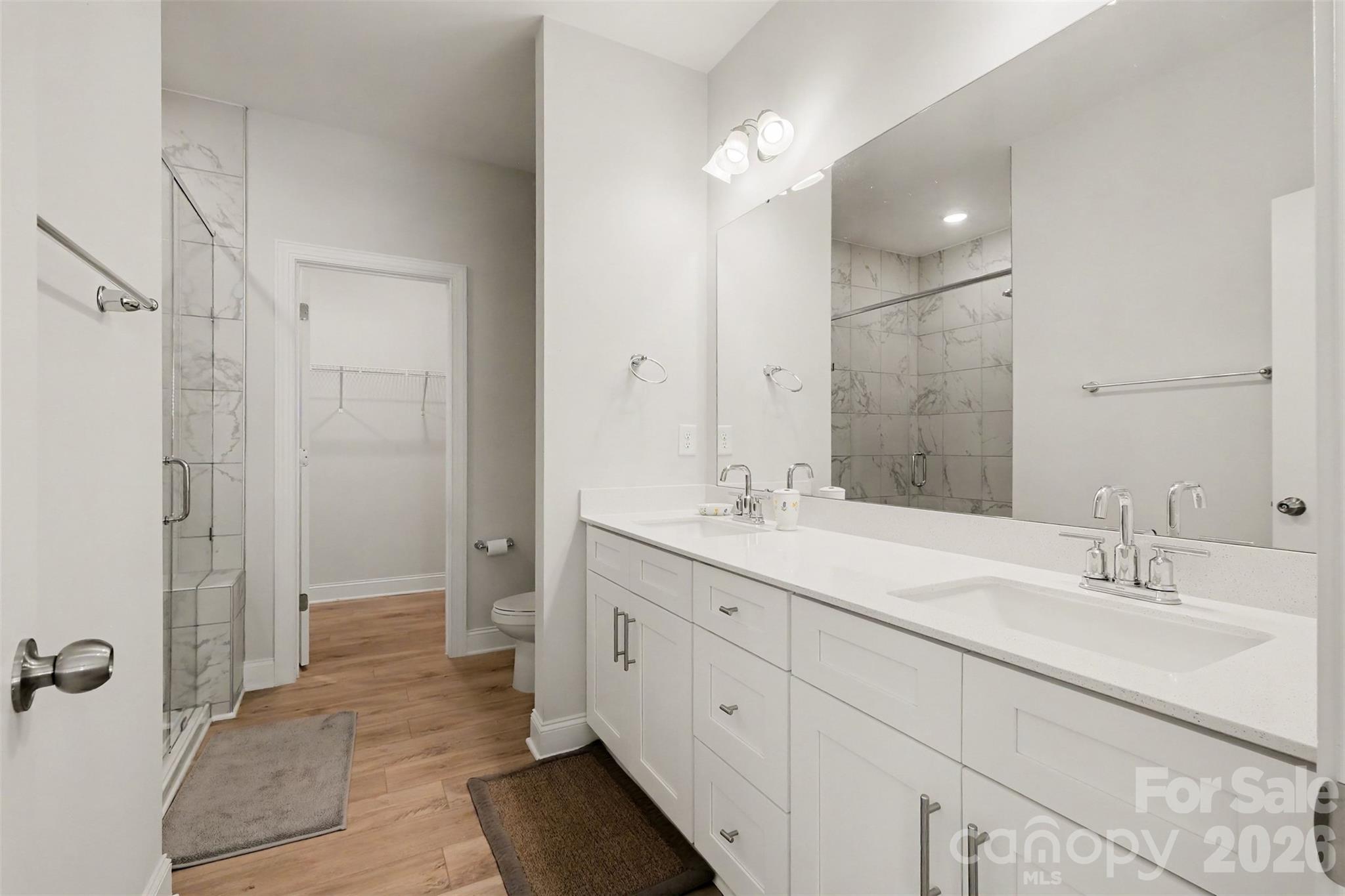 Double sinks, frameless glass shower and large walk in closet off the primary. - 4159 Black Court, Harrisburg
