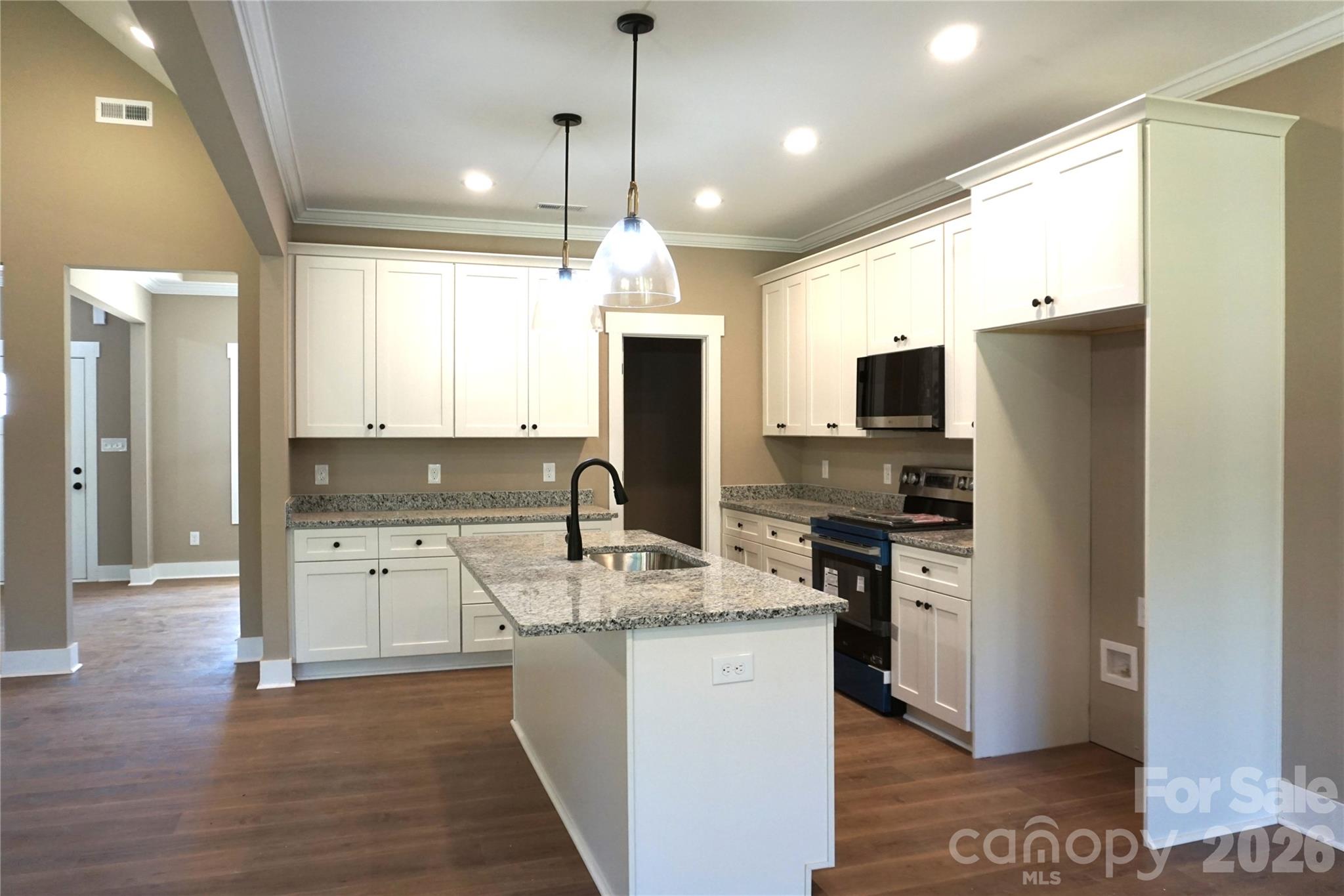Kitchen Island with breakfast bar. - 989 Rhyne Road, Clover