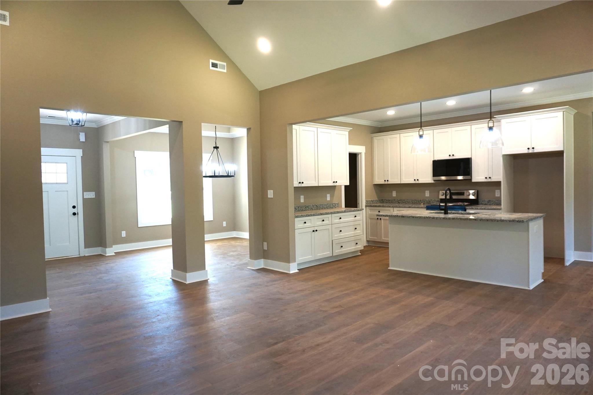 Open floorplan with Luxury Vinyl flooring throughout. - 989 Rhyne Road, Clover