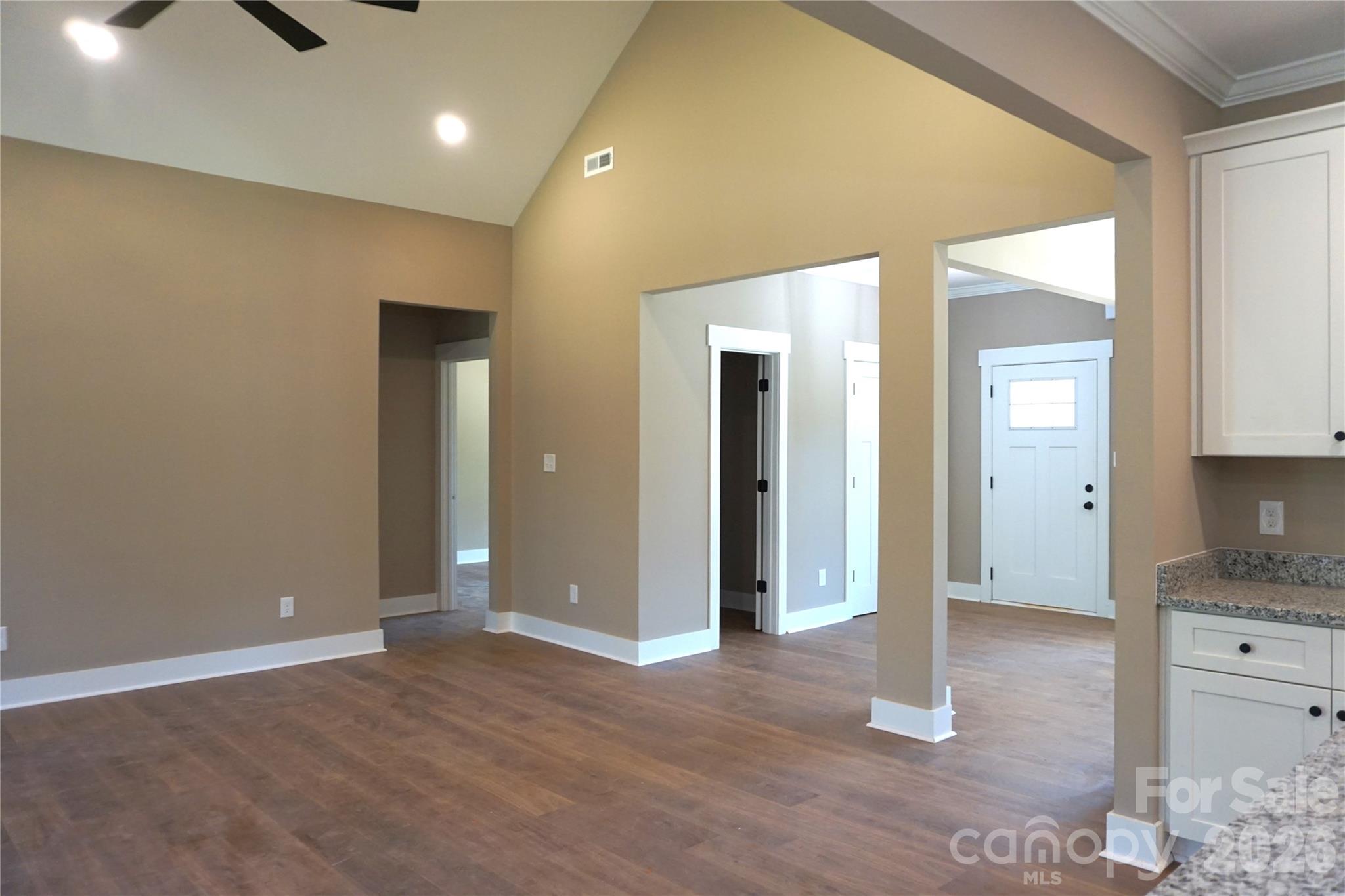 Entrance to the home with a half bath located in the foyer along with a large coat closet. - 989 Rhyne Road, Clover