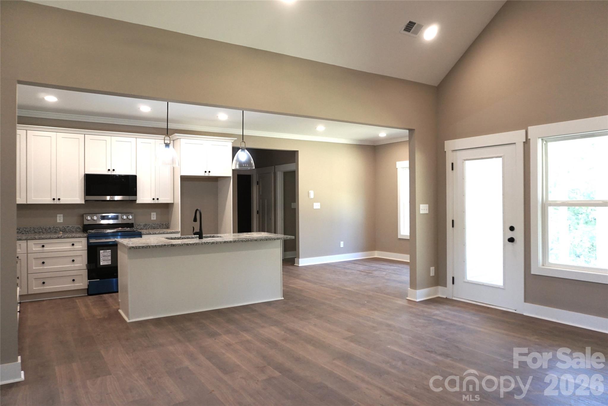 Exterior door off the family room leads to the beautiful back covered porch. - 989 Rhyne Road, Clover