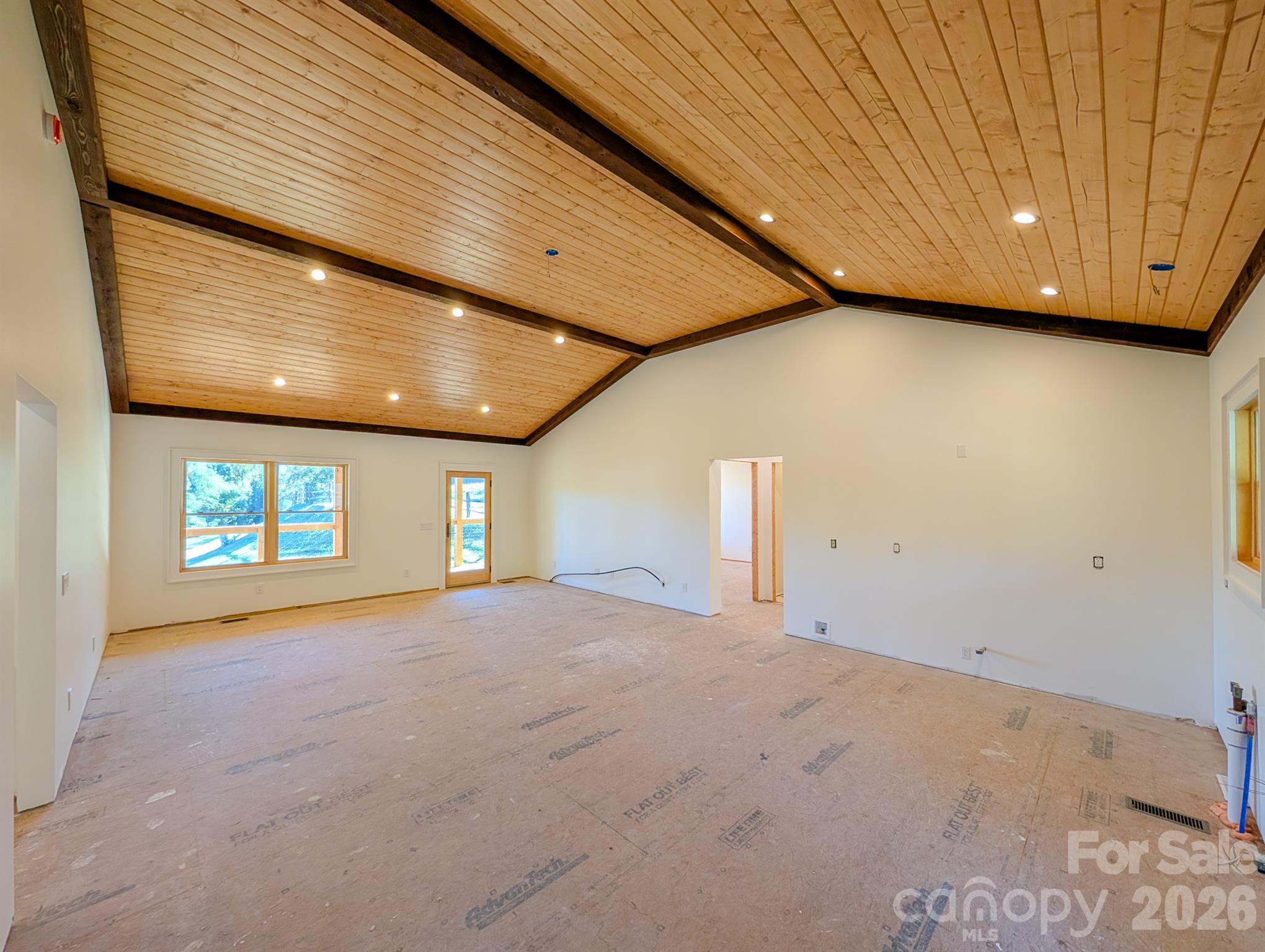 Additional View of Great room with gorgeous custom designed tongue & groove ceiling & recessed lighting. Designed for kitchen and living area. - 338 Majestic Mountain Drive, Burnsville