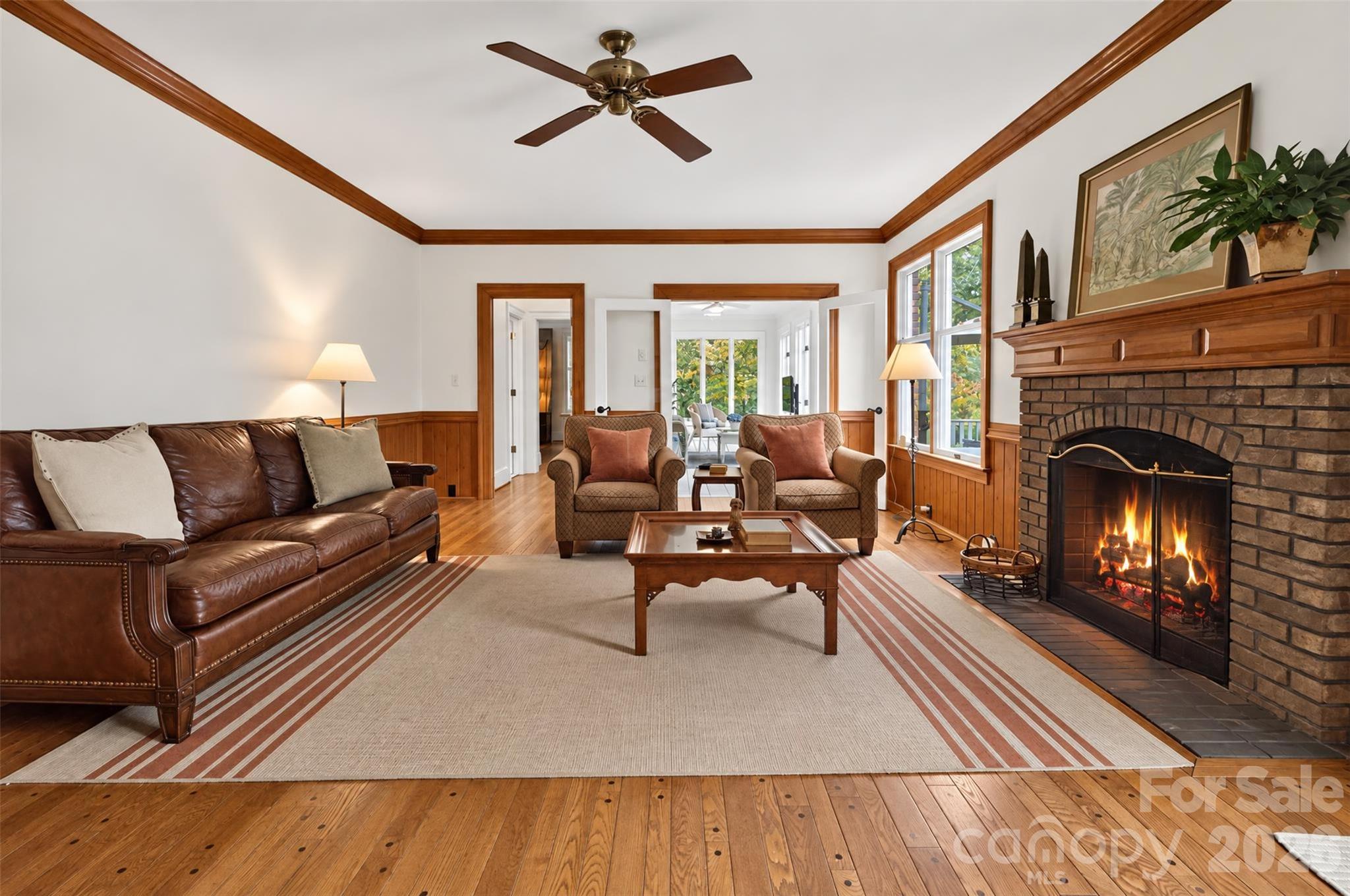 Light filled sunroom in the background - 2715 Brevard Road, Hendersonville