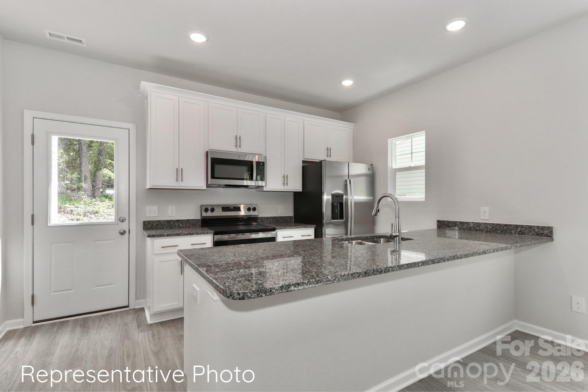 Counter tops will be white quartz. - 792 Hillard Street, Statesville