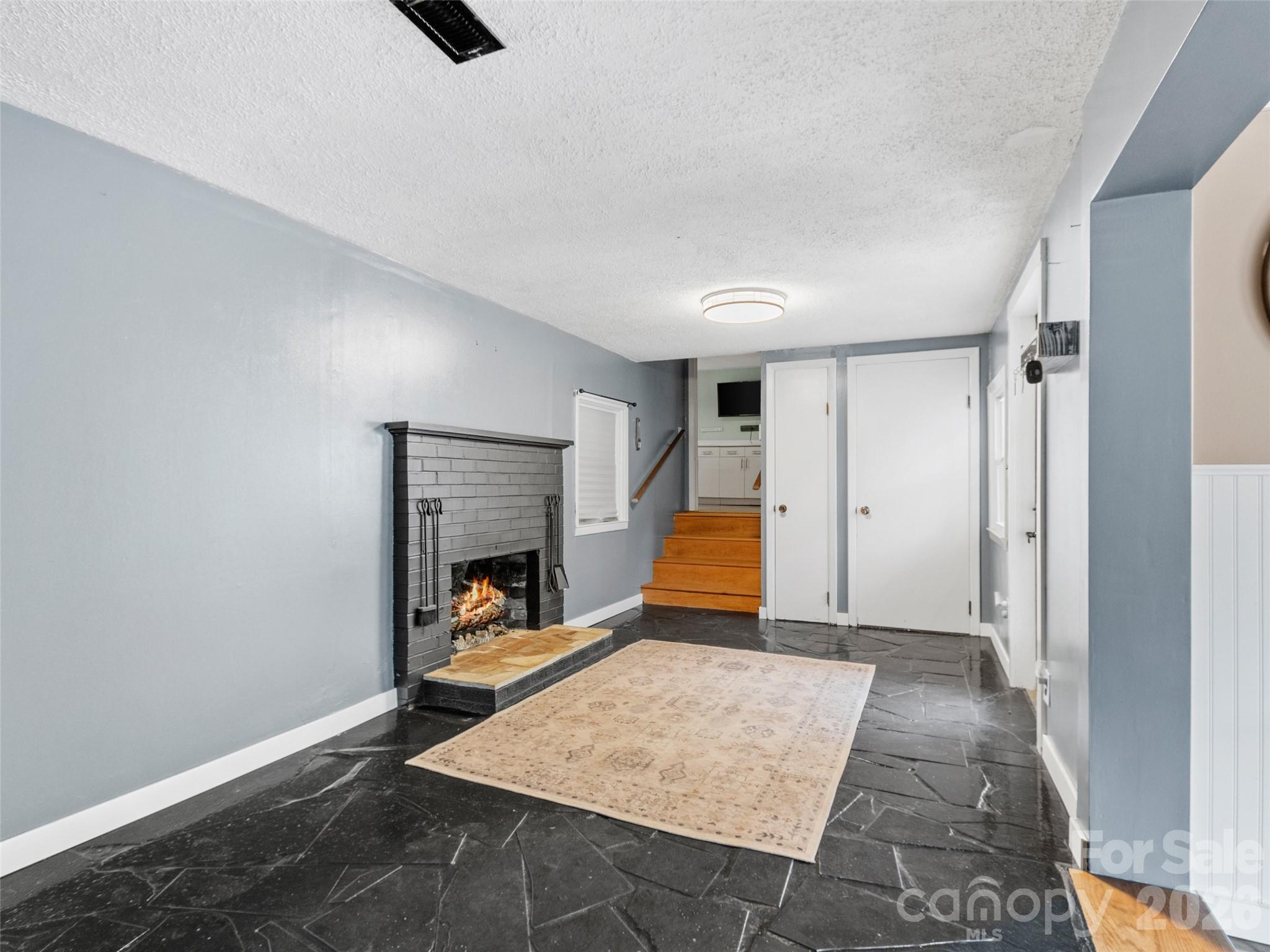 Gas log fireplace in Front Parlour. - 12982 US 19W Highway, Burnsville