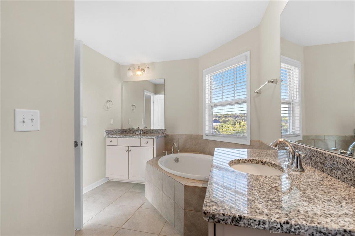primary bath with garden tub - 6556 Harris River Way, Charlotte