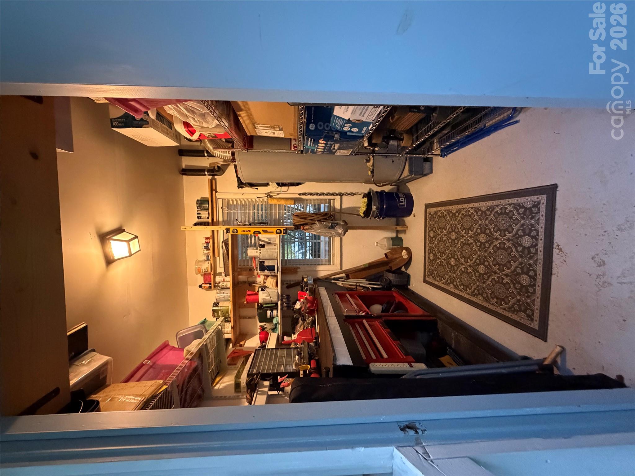 Storage room on back of house. Shelving and Window. - 4126 Medford Drive NW, Concord