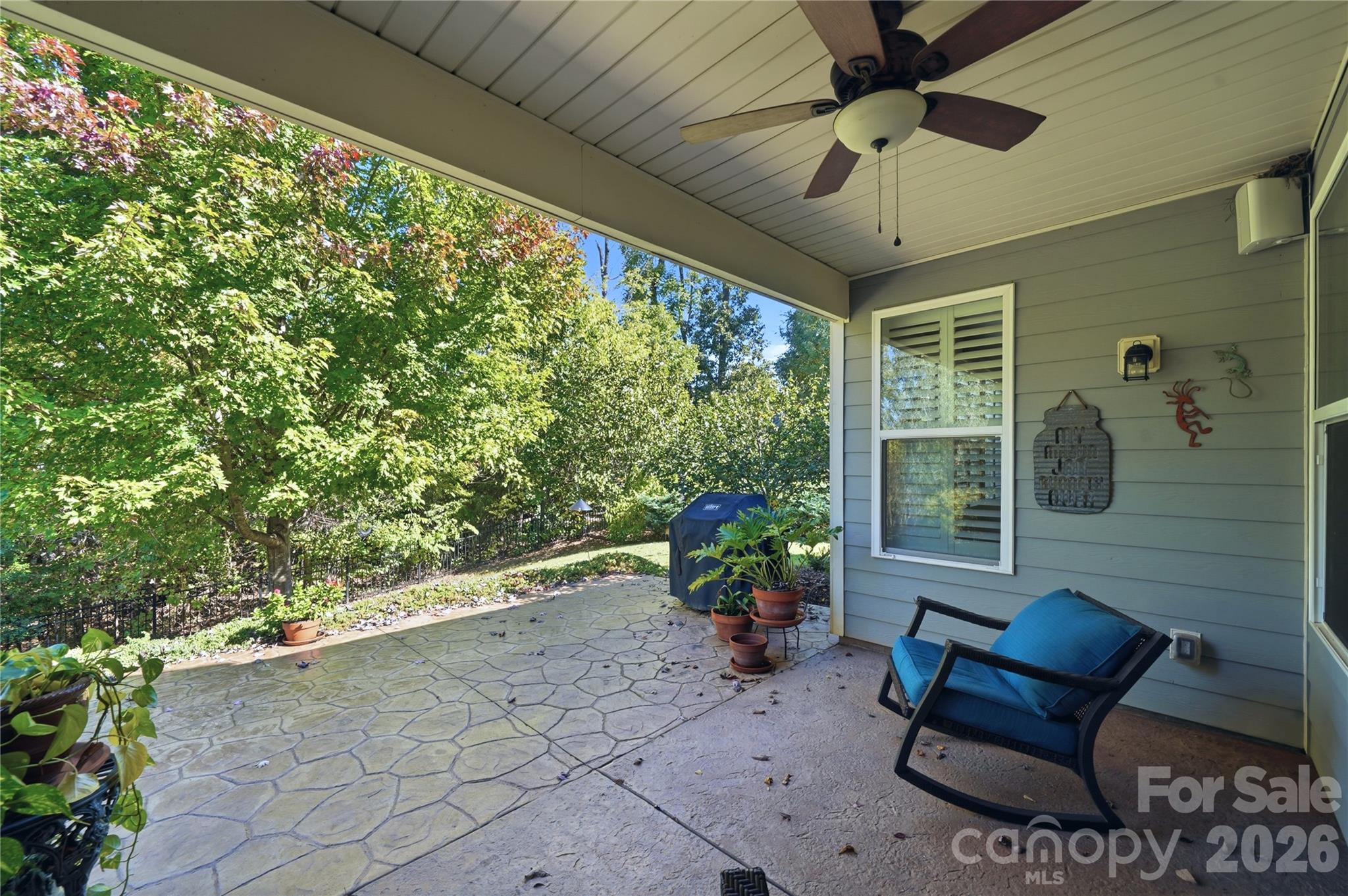 Enjoy your morning coffee on this Quiet and Peaceful Covered Porch - 8719 Shadetree Street, Huntersville