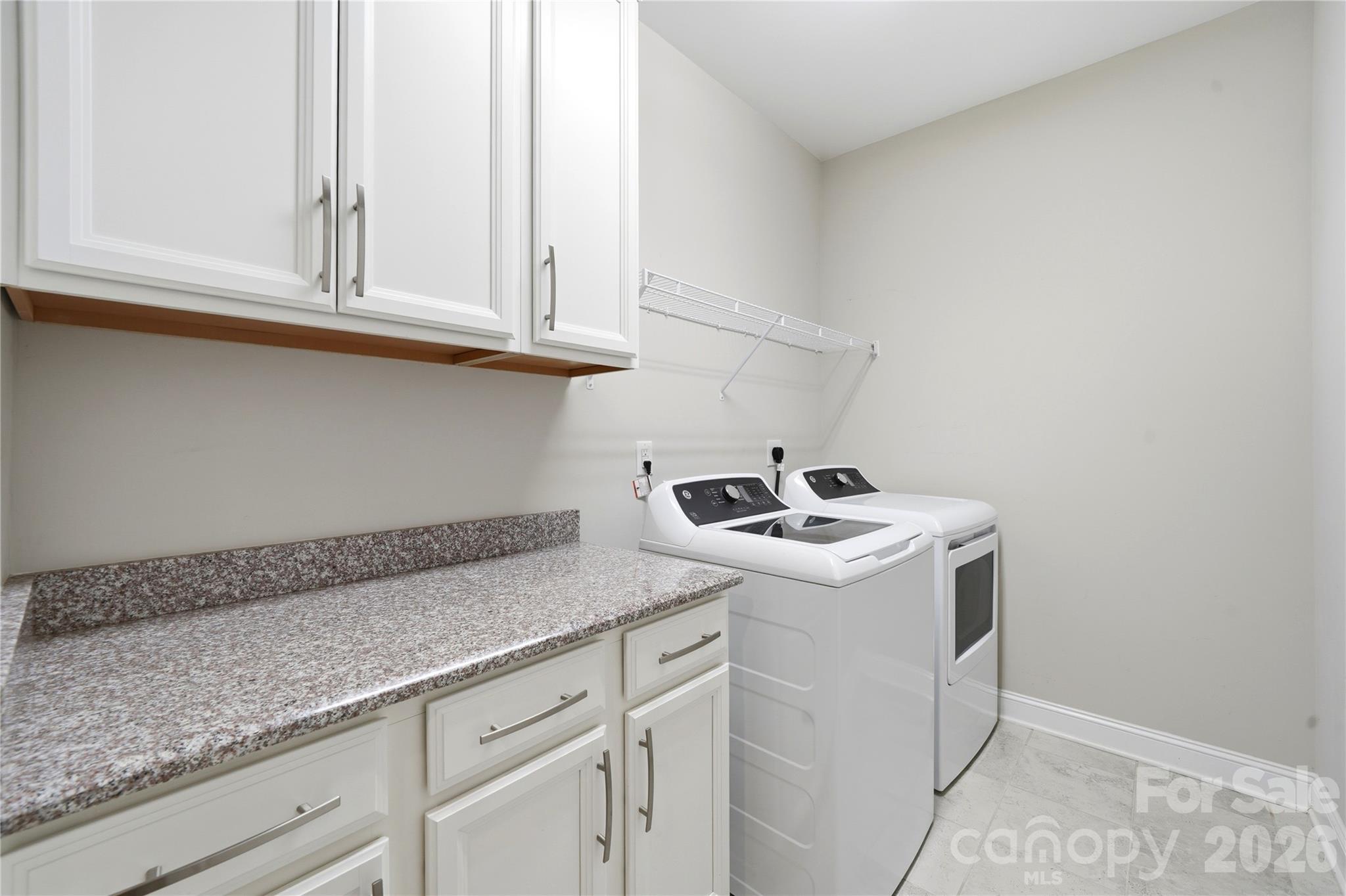Spacious Laundry Room with a lot of Storage - 8719 Shadetree Street, Huntersville