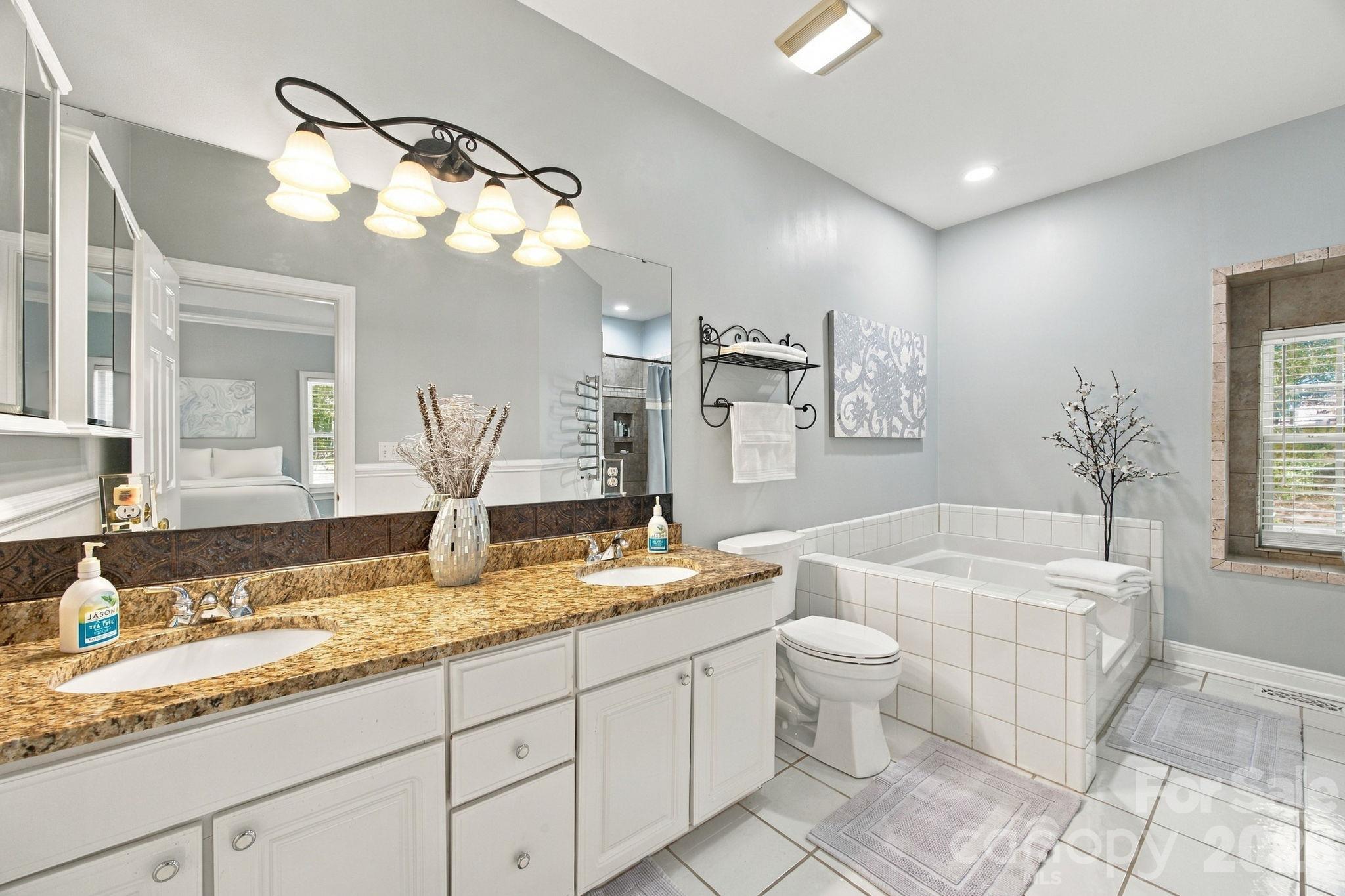 Primary bedroom ensuite bath. - 6611 Providence Road S, Waxhaw
