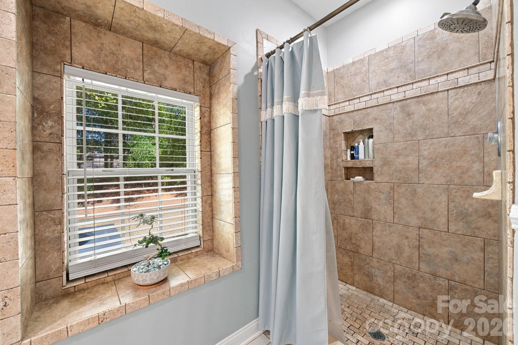 Primary bedroom ensuite bath. - 6611 Providence Road S, Waxhaw