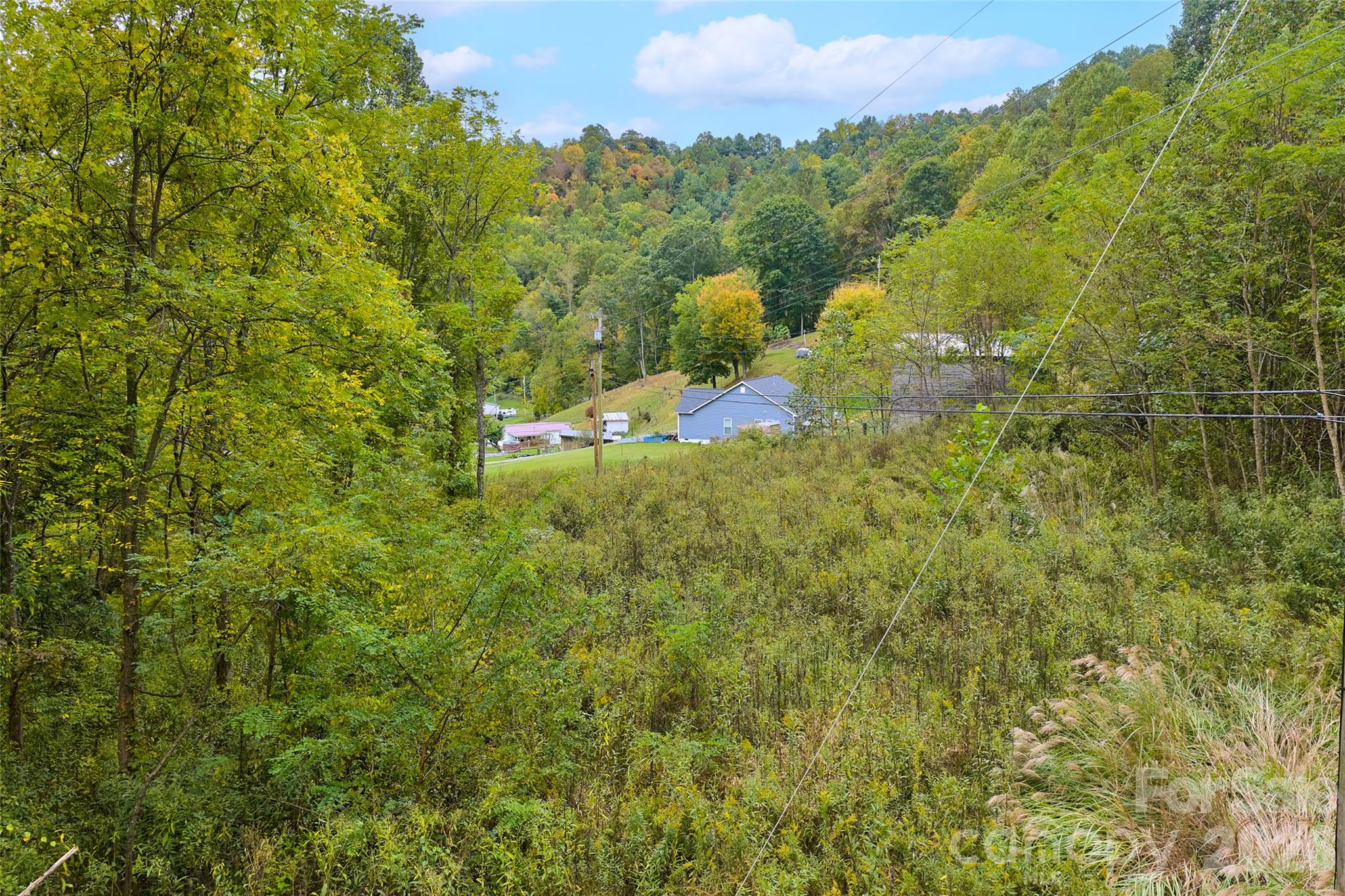 Looking back from the property to the closest home - 348 Chandler Creek Road, Mars Hill