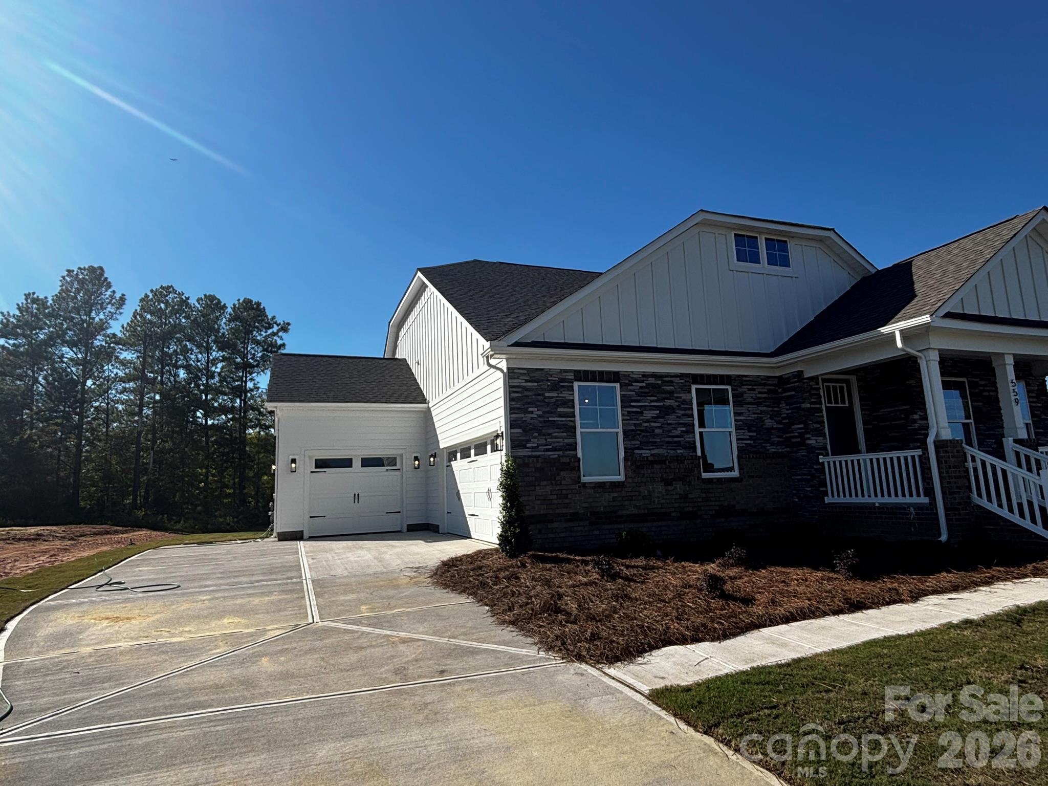 Homesite 13 features a Harrison E floorplan Two Car Sideload garage and Utility Garage - 559 Cheryl Lynn Drive, Rock Hill