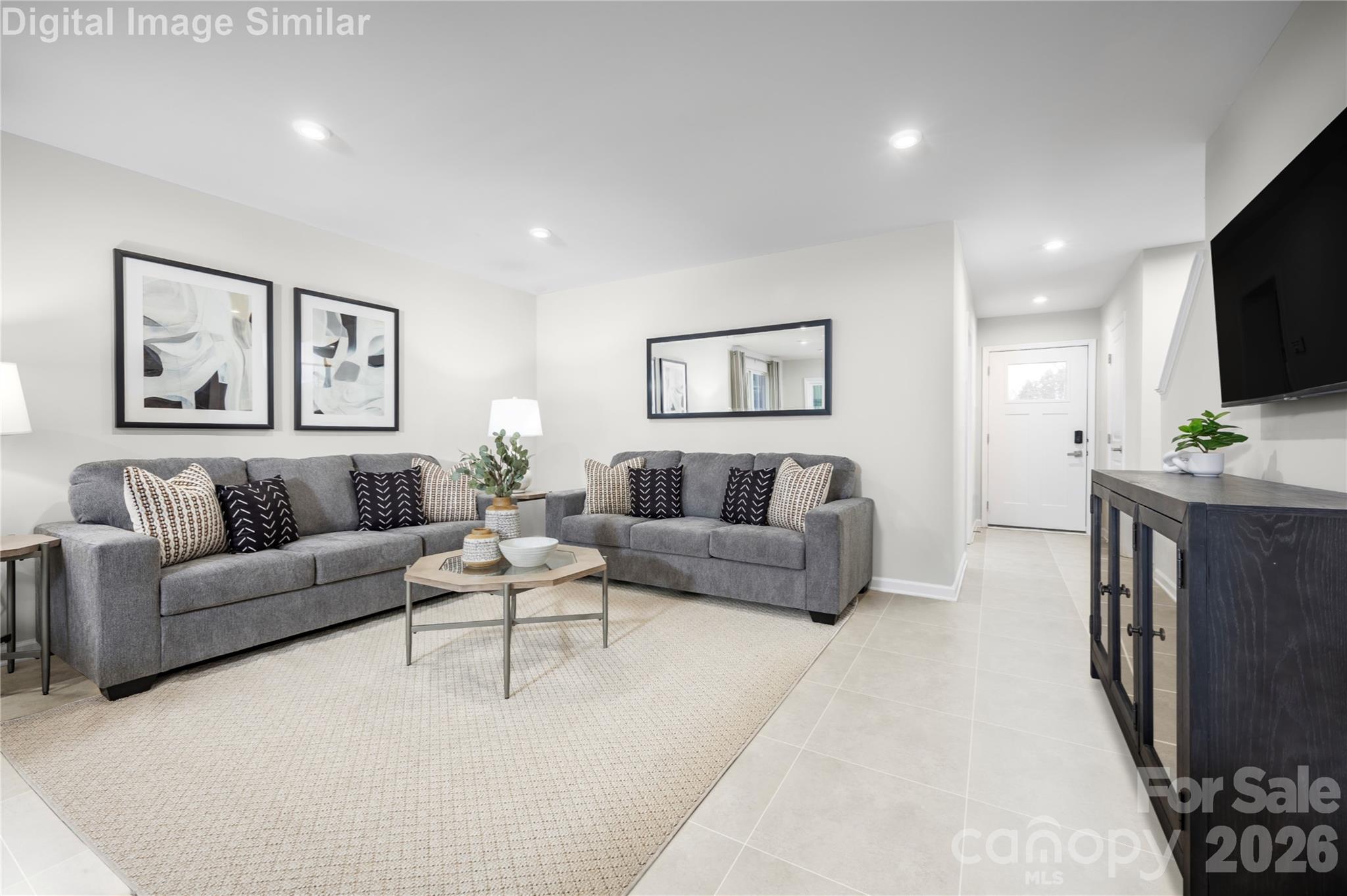 Unwind and connect—this Great Room is your go-to space for movie nights, family time, and everyday memories. - 5215 Macvittie Lane, Charlotte