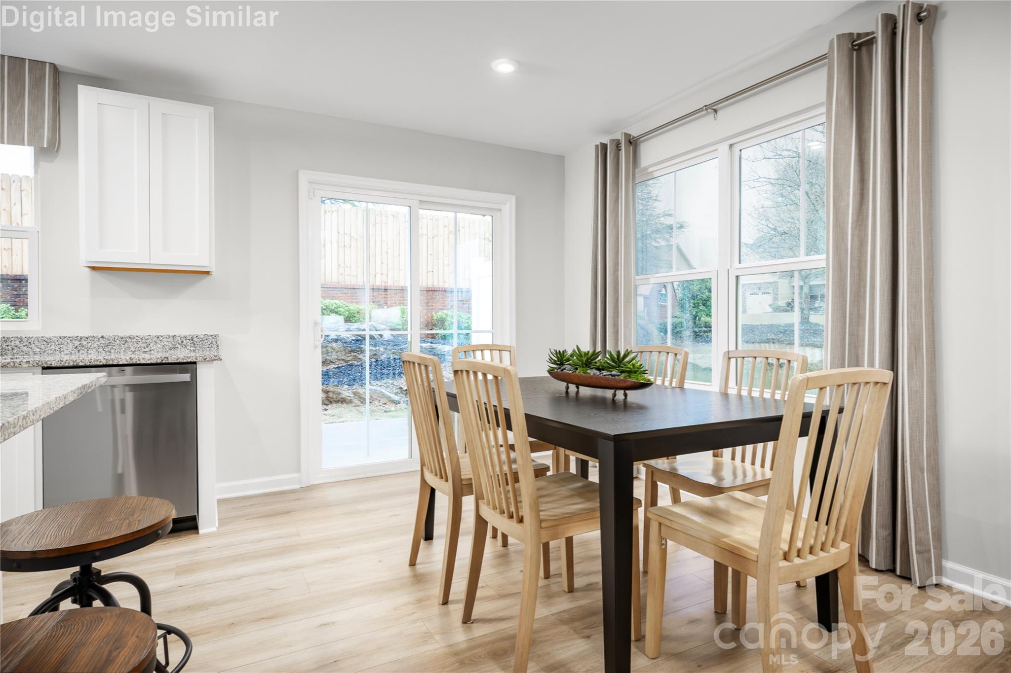 Come together over delicious meals and shared laughter—this dining space is made for moments that matter. - 5219 Macvittie Lane, Charlotte
