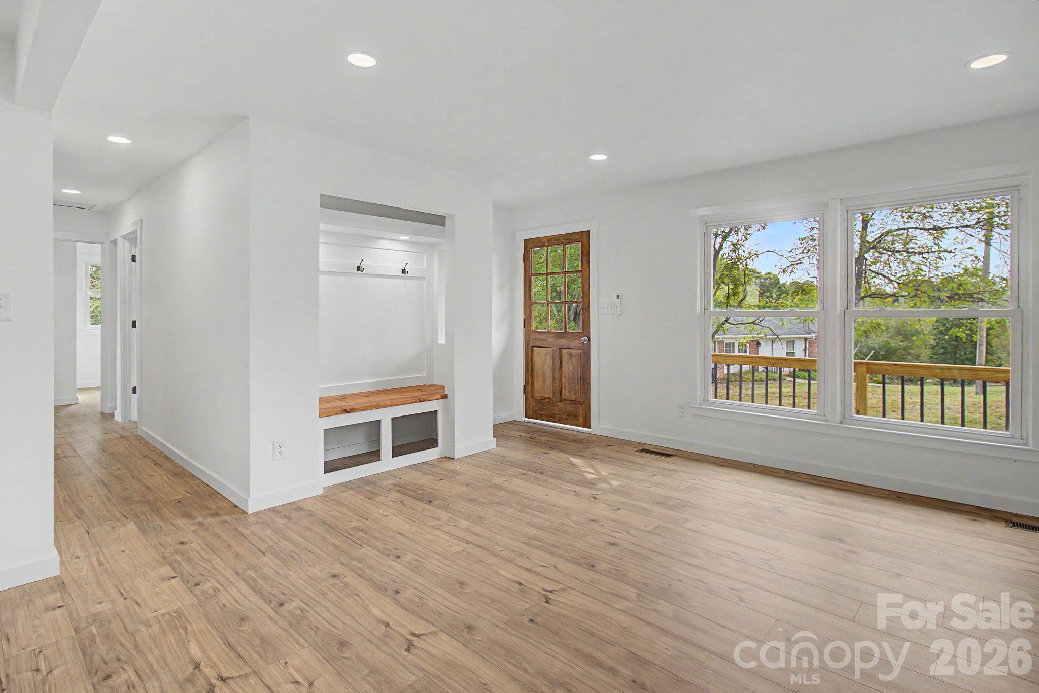 Living room has a nice built in area and lots of natural light. - 14 Kirby Place, Asheville