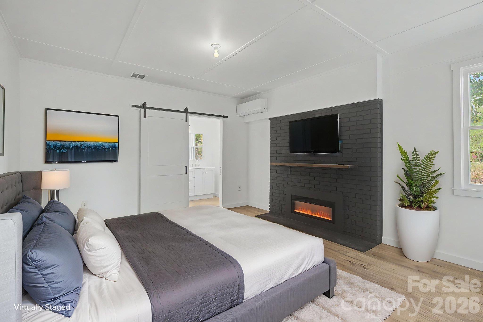 AI staged photo of Primary Bedroom w/electric fireplace - 14 Kirby Place, Asheville