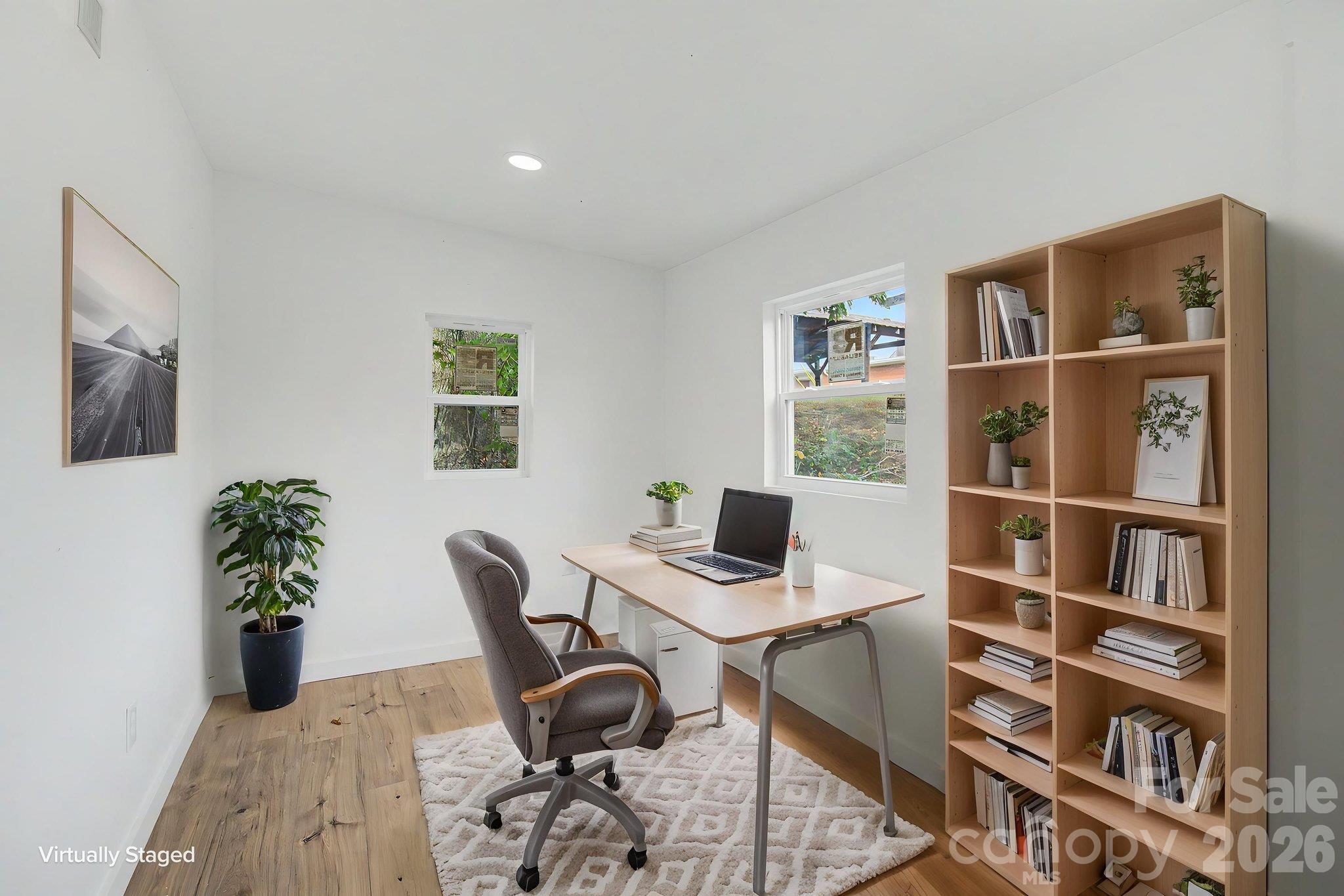 Bonus room off Primary bedroom perfect for an office. Laundry closet is located in this room. AI staged photo - 14 Kirby Place, Asheville