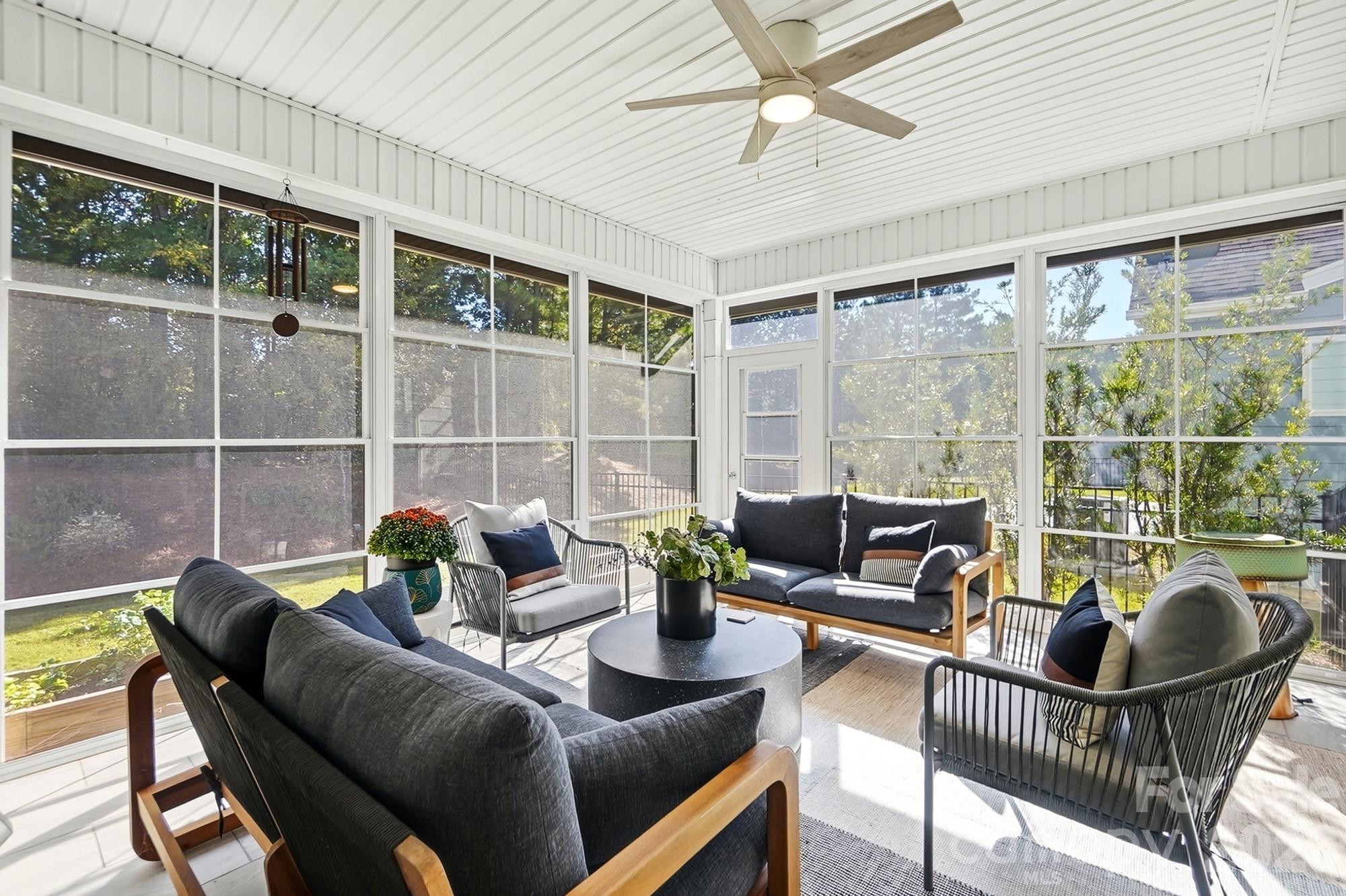 Relax in 3 season room with Eze Breeze window and auto shades - 2014 Old Evergreen Parkway, Indian Trail