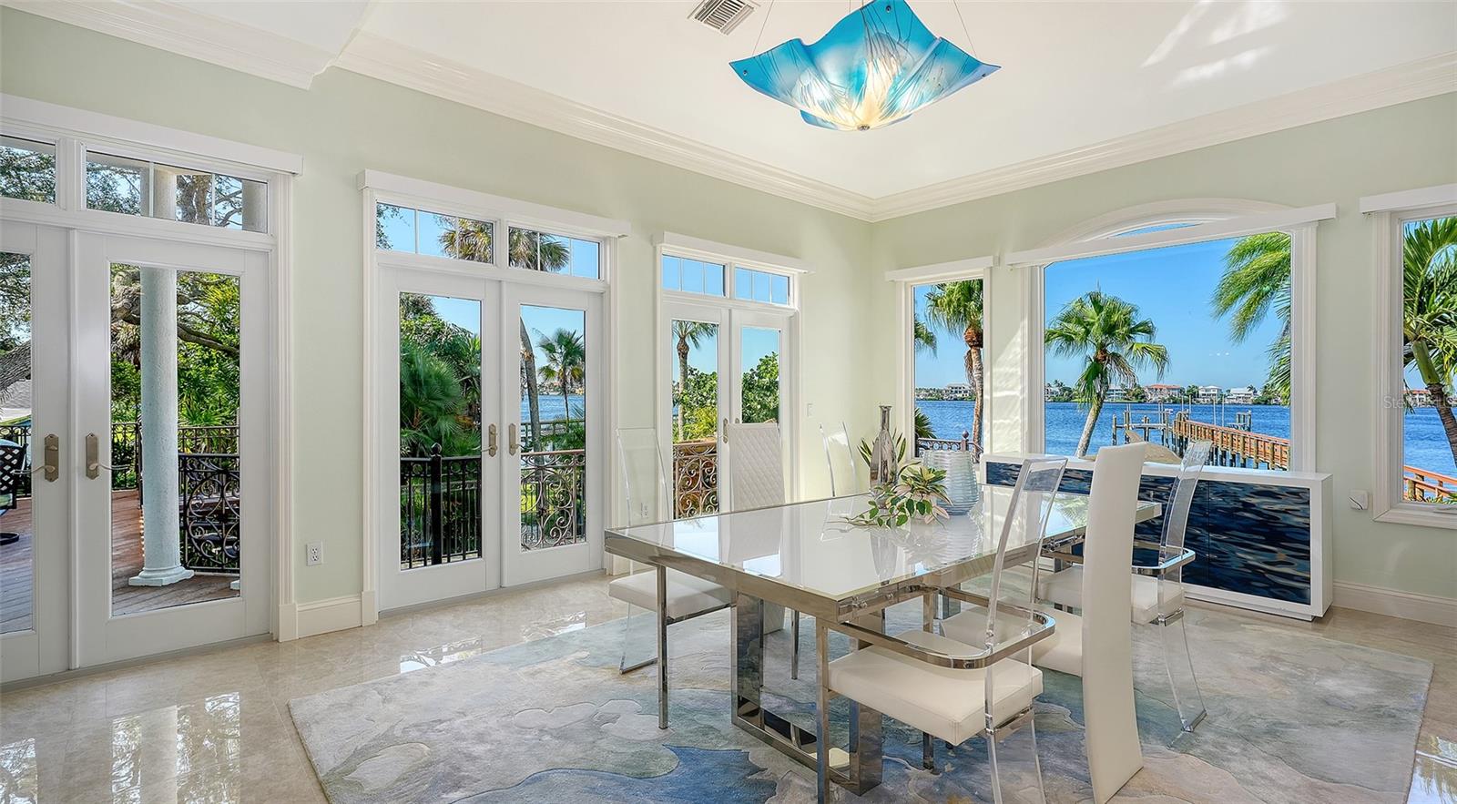 easy access to side catwalk that connects to 1st floor primary and covered outdoor living space with fireplace and outdoor kitichen - 2115 LYCHEE LN, NOKOMIS