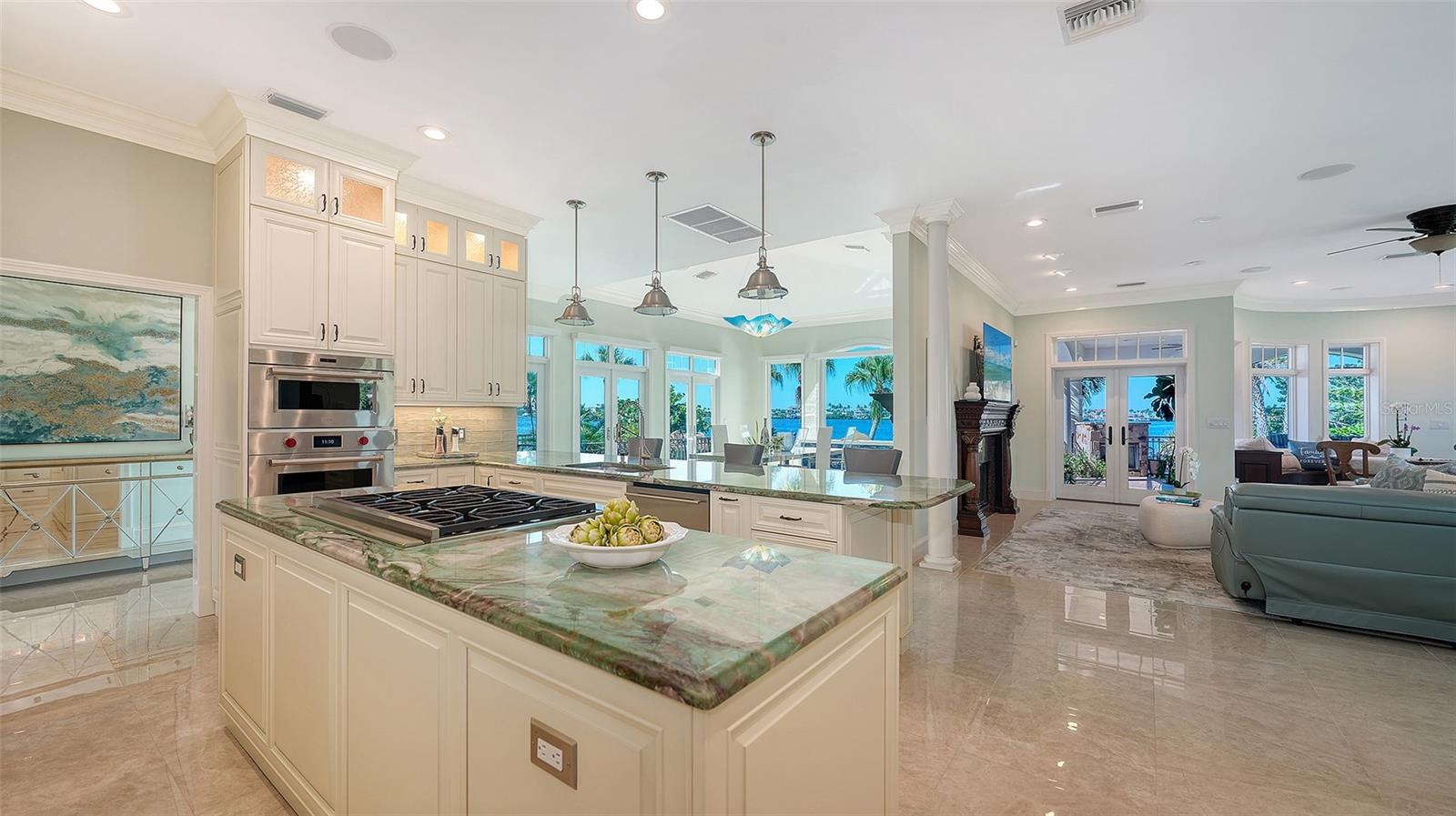 Kitchen looking out to the living area and dining room and expansive waterviews - 2115 LYCHEE LN, NOKOMIS