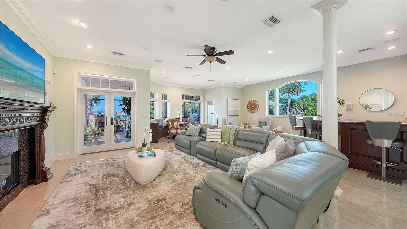 plenty of views of the water in this expansive family room - 2115 LYCHEE LN, NOKOMIS