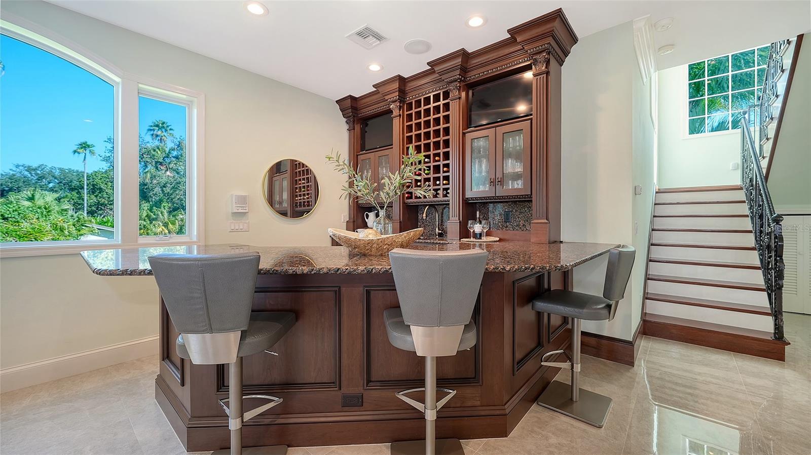custom bar ideal for entertaining, stairs lead to second floor private owners suite - 2115 LYCHEE LN, NOKOMIS