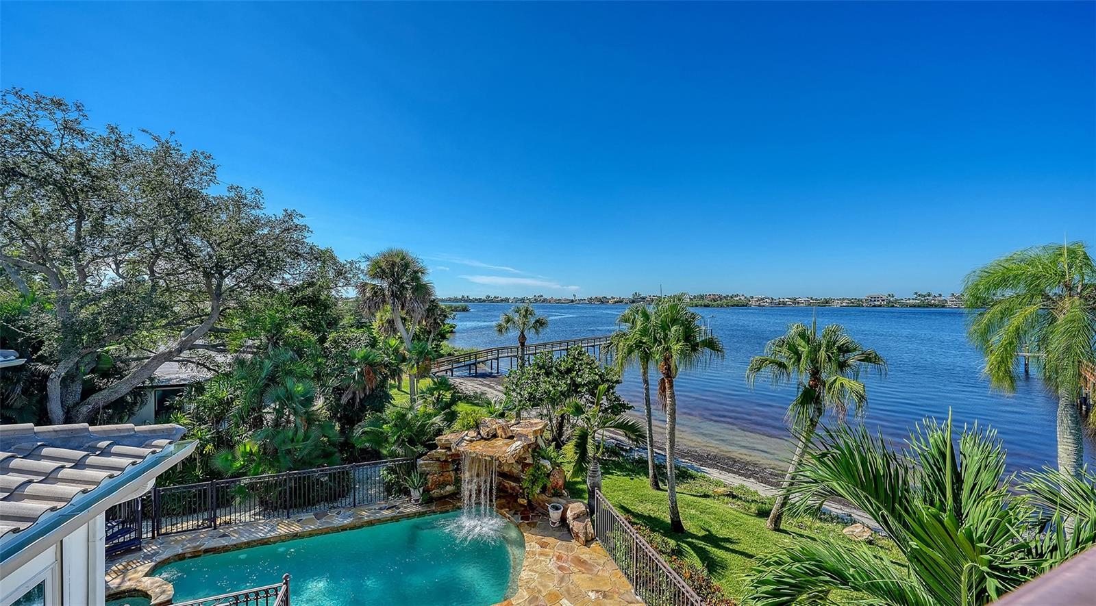 view to the pool areas from owners suite and enjoy the sounds of the waterfall - 2115 LYCHEE LN, NOKOMIS