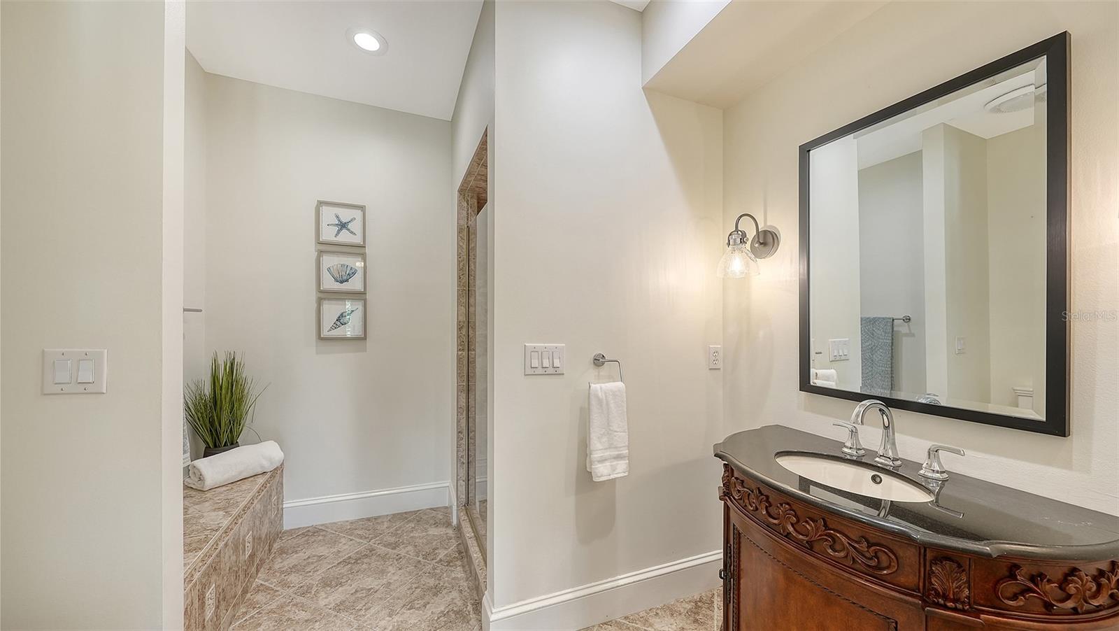en suite for the guest bedroom with walk in shower - 2115 LYCHEE LN, NOKOMIS