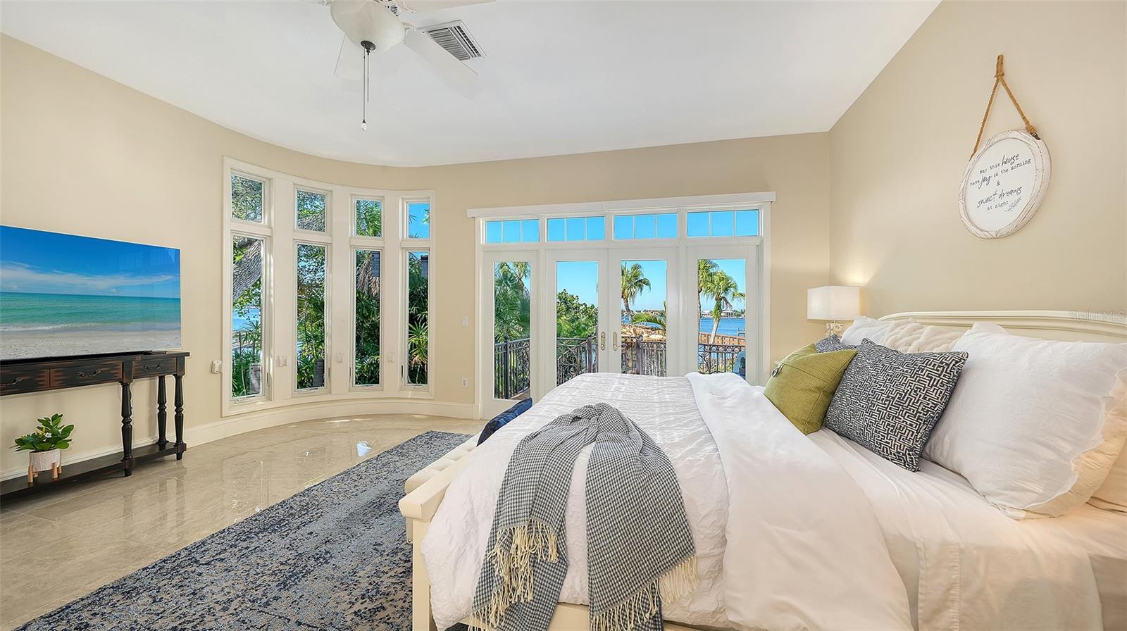 first floor primary bedroom with balcony and stunning views - 2115 LYCHEE LN, NOKOMIS