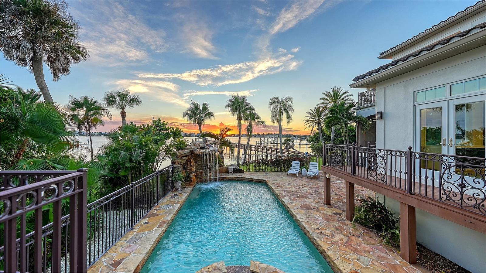 Easy access from kitchen/dining room/ outdoor living space/ first floor primary bedroom to the pool area - 2115 LYCHEE LN, NOKOMIS