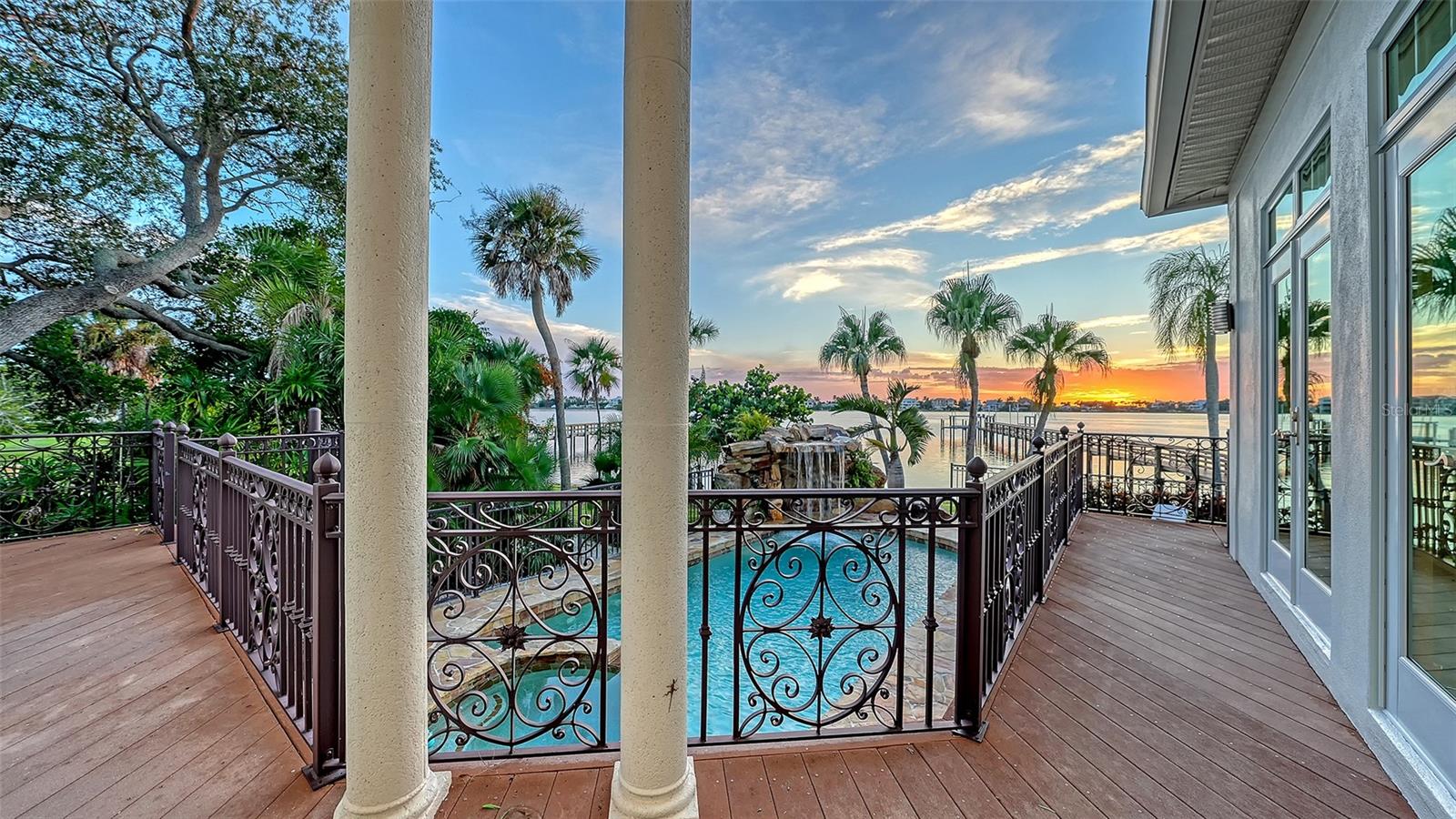 Deck along first floor level connecting all the living spaces - 2115 LYCHEE LN, NOKOMIS