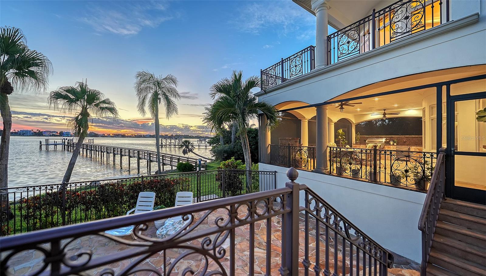Looking at the outdoor covered living space in the evening - 2115 LYCHEE LN, NOKOMIS