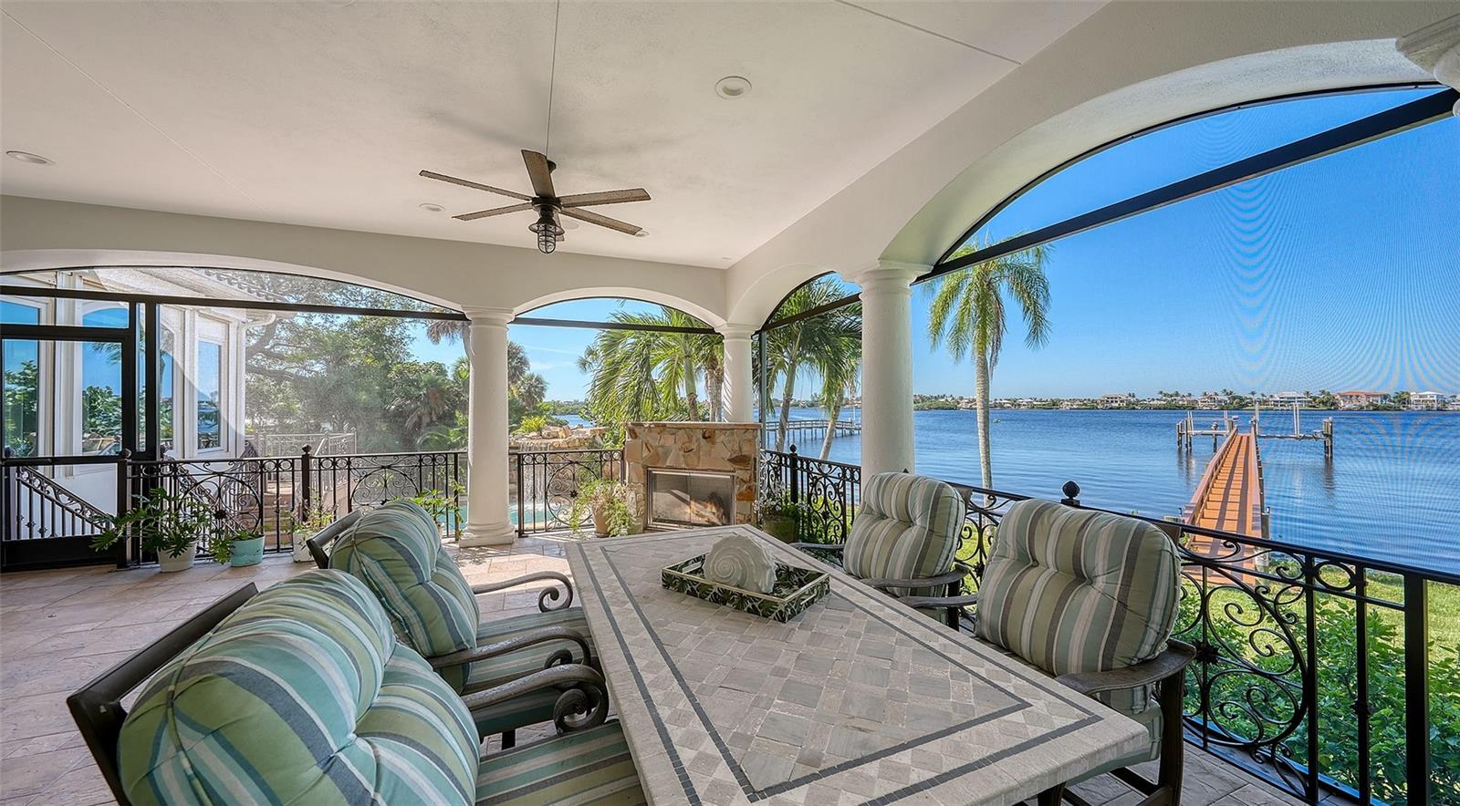 stunning view of the water and dock and the pool area - 2115 LYCHEE LN, NOKOMIS